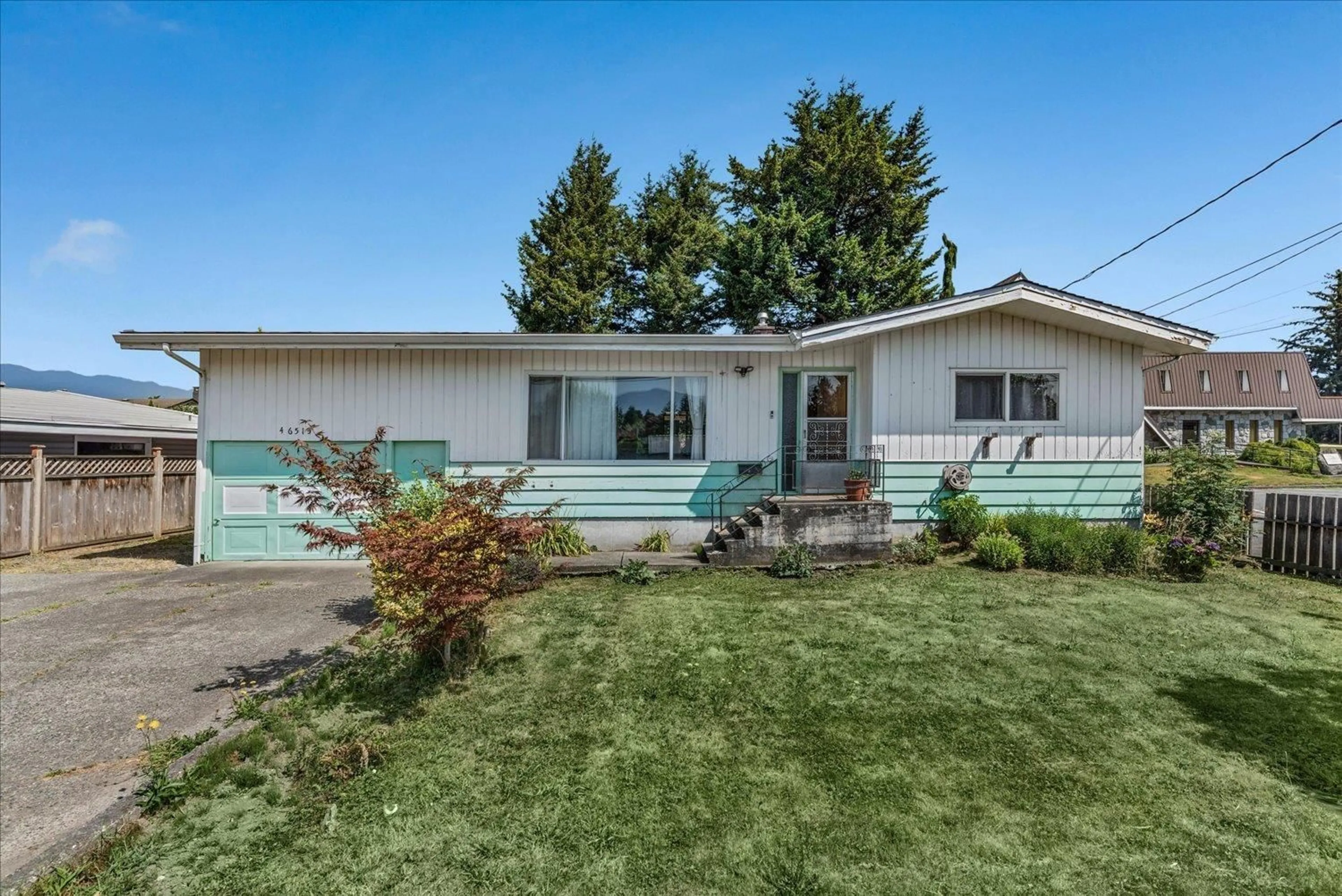 Home with vinyl exterior material, street for 46515 CHILLIWACK CENTRAL ROAD, Chilliwack British Columbia V2P1K1