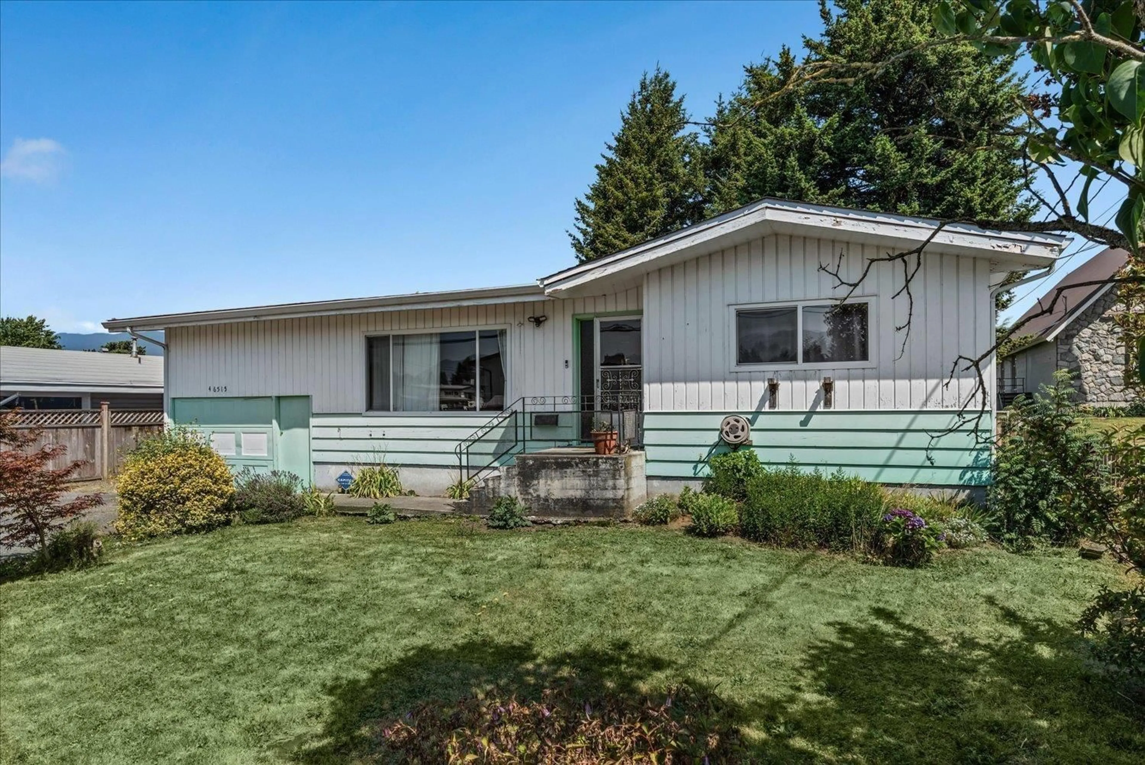 Home with vinyl exterior material, street for 46515 CHILLIWACK CENTRAL ROAD, Chilliwack British Columbia V2P1K1
