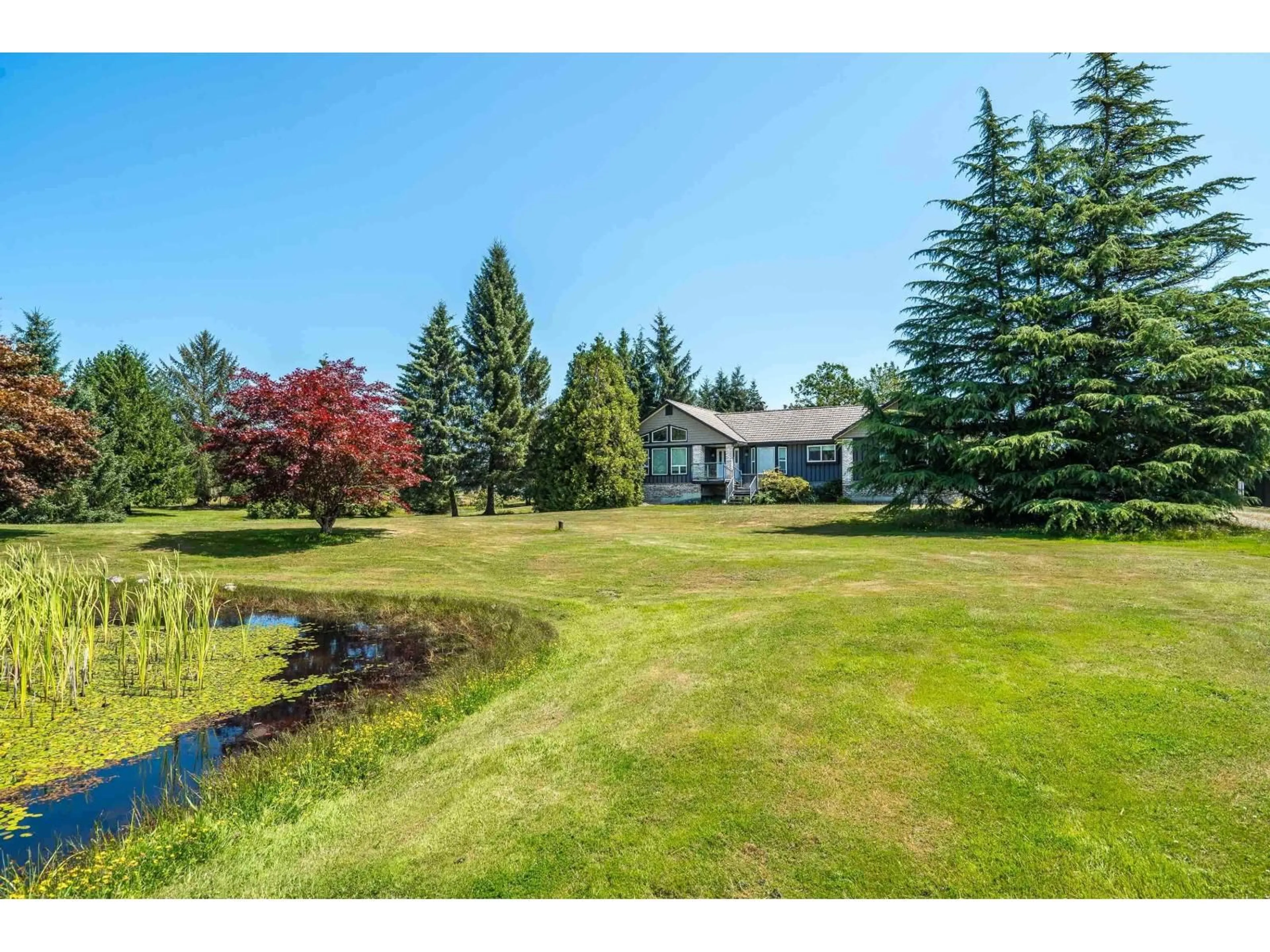 A pic from outside/outdoor area/front of a property/back of a property/a pic from drone, water/lake/river/ocean view for 7094 267 STREET, Langley British Columbia V4W1W2