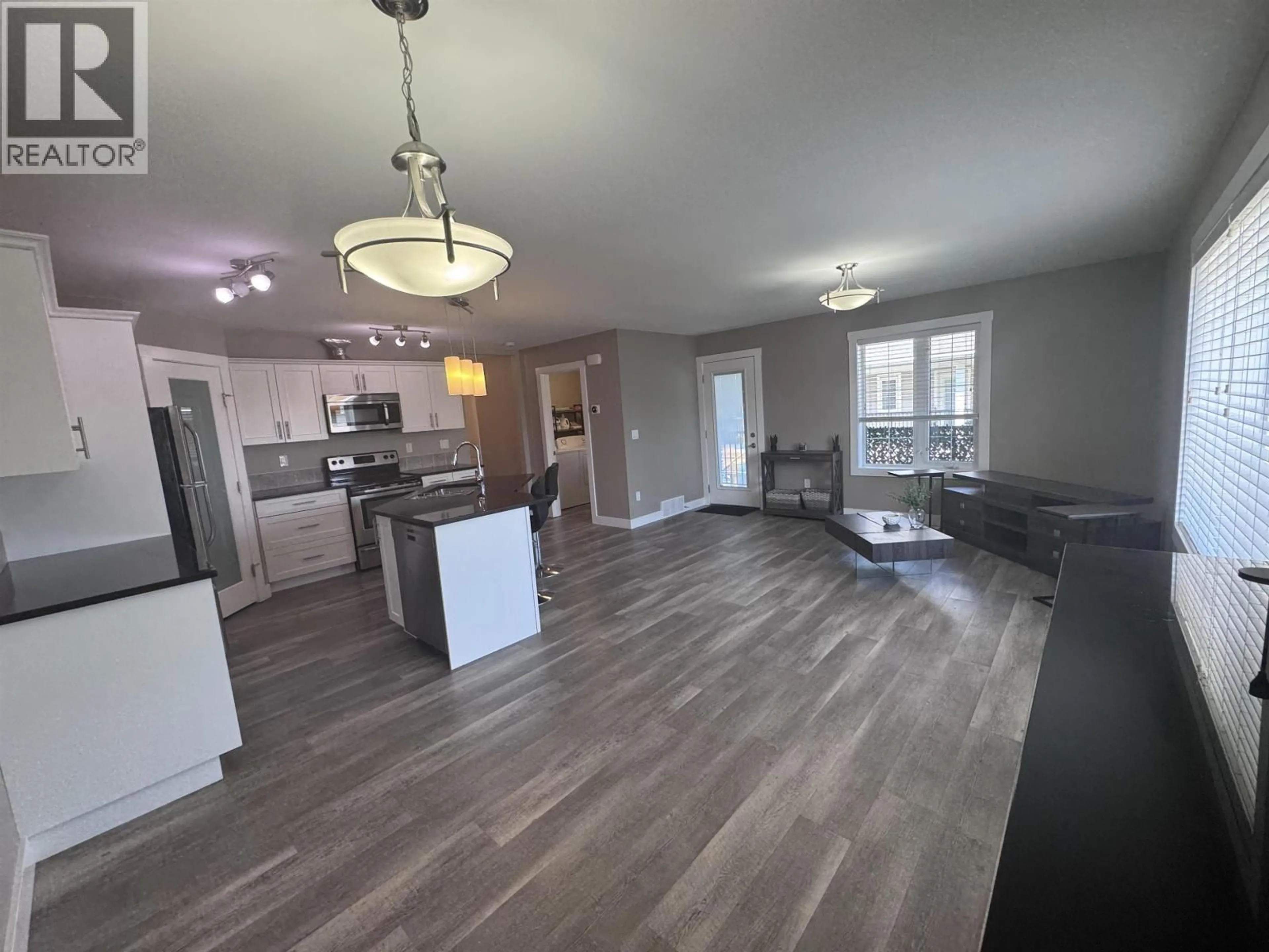 Open concept kitchen, wood/laminate floor for 124 - 10104 114A AVENUE, Fort St. John British Columbia V1J0K5