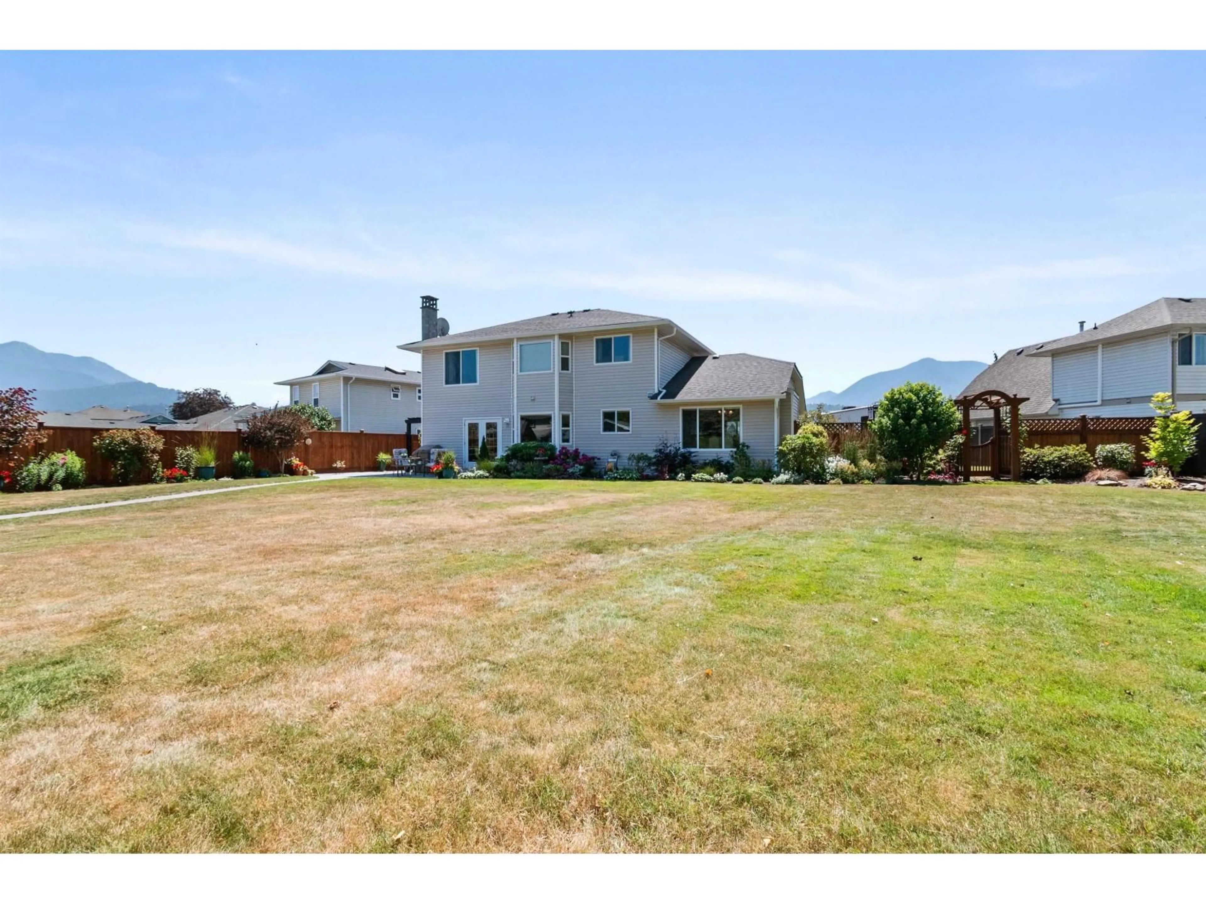 A pic from outside/outdoor area/front of a property/back of a property/a pic from drone, mountain view for 6755 HENRY STREET, Chilliwack British Columbia V2R2Z9