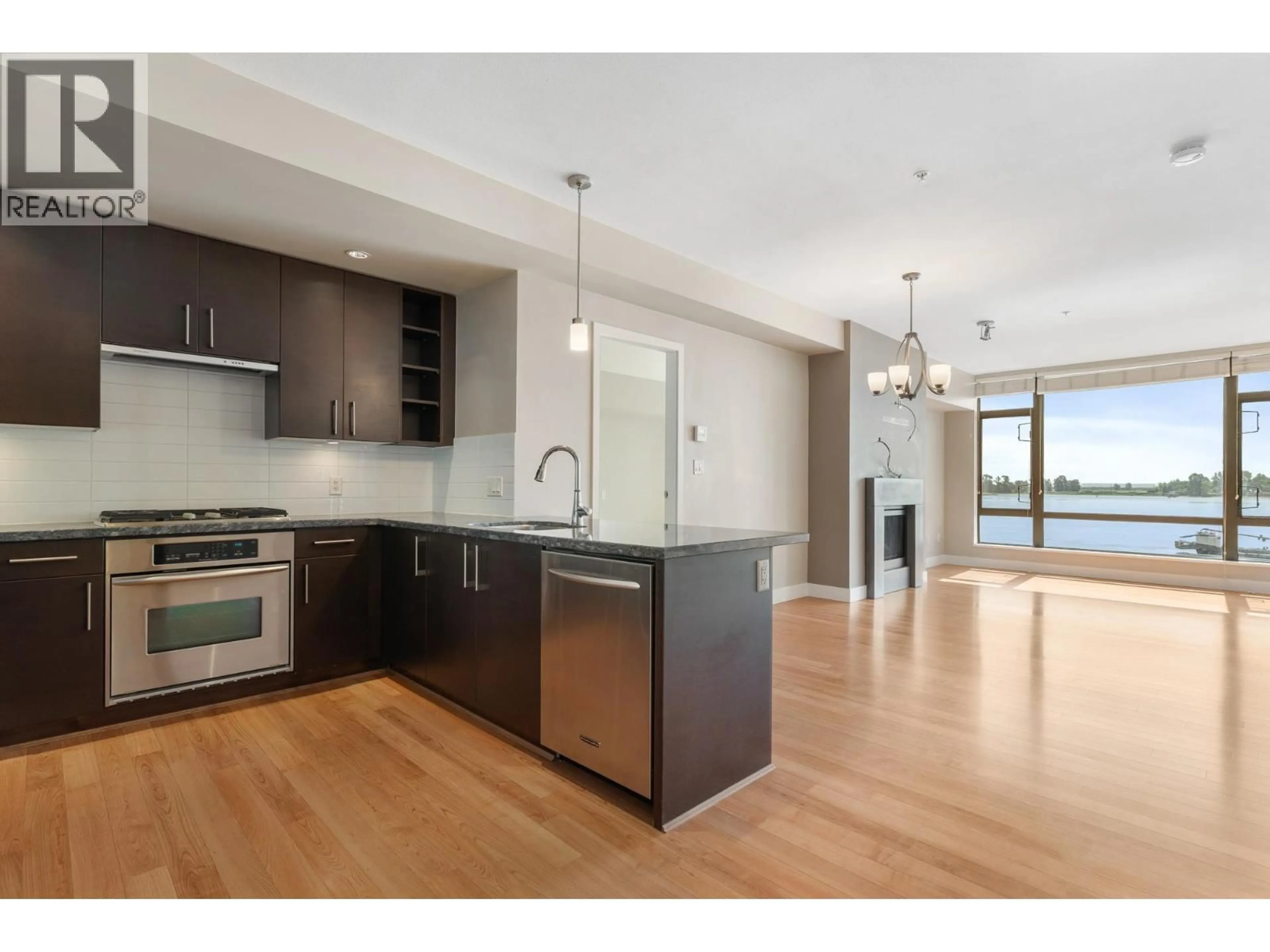 Open concept kitchen, wood/laminate floor for 302 - 14200 RIVERPORT WAY, Richmond British Columbia V6W1M4
