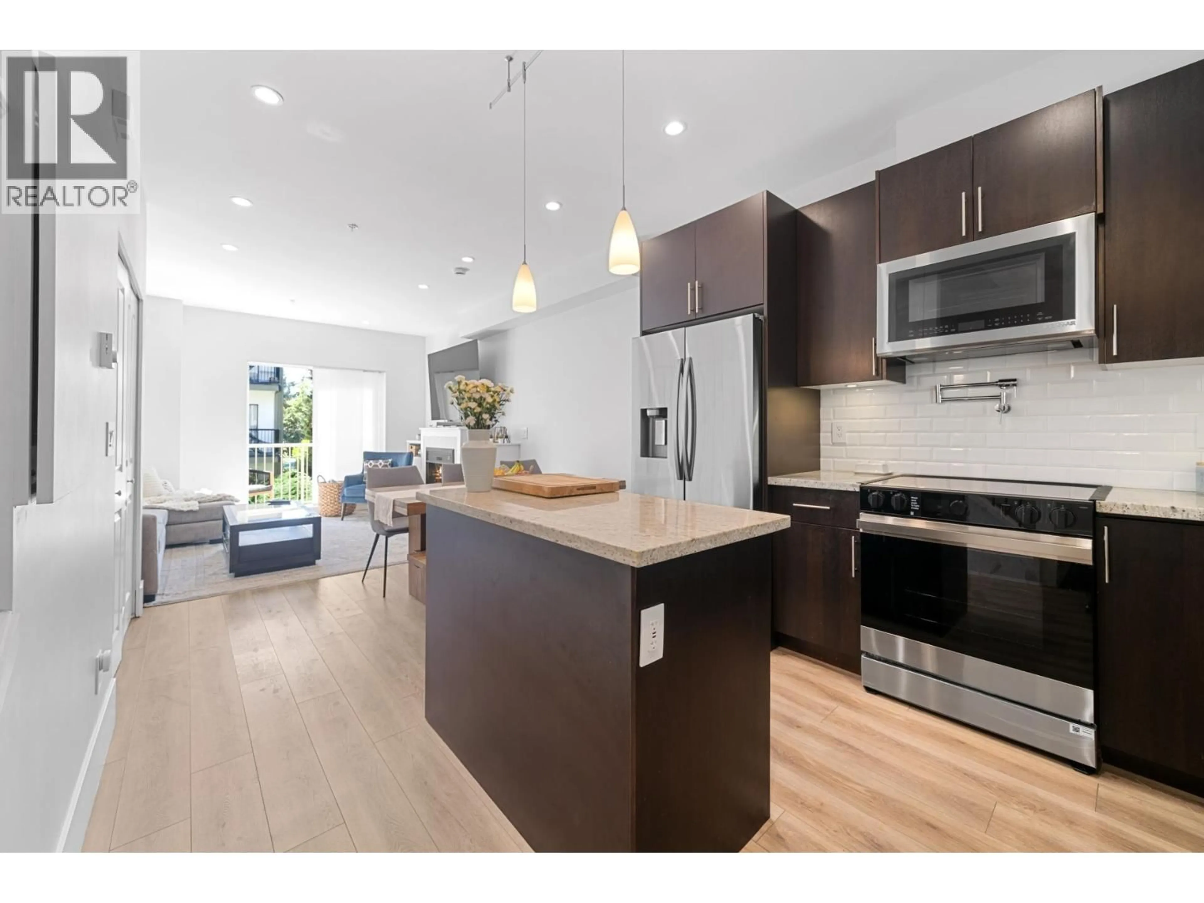 Open concept kitchen, wood/laminate floor for 223 - 368 ELLESMERE AVENUE, Burnaby British Columbia V5B3S9