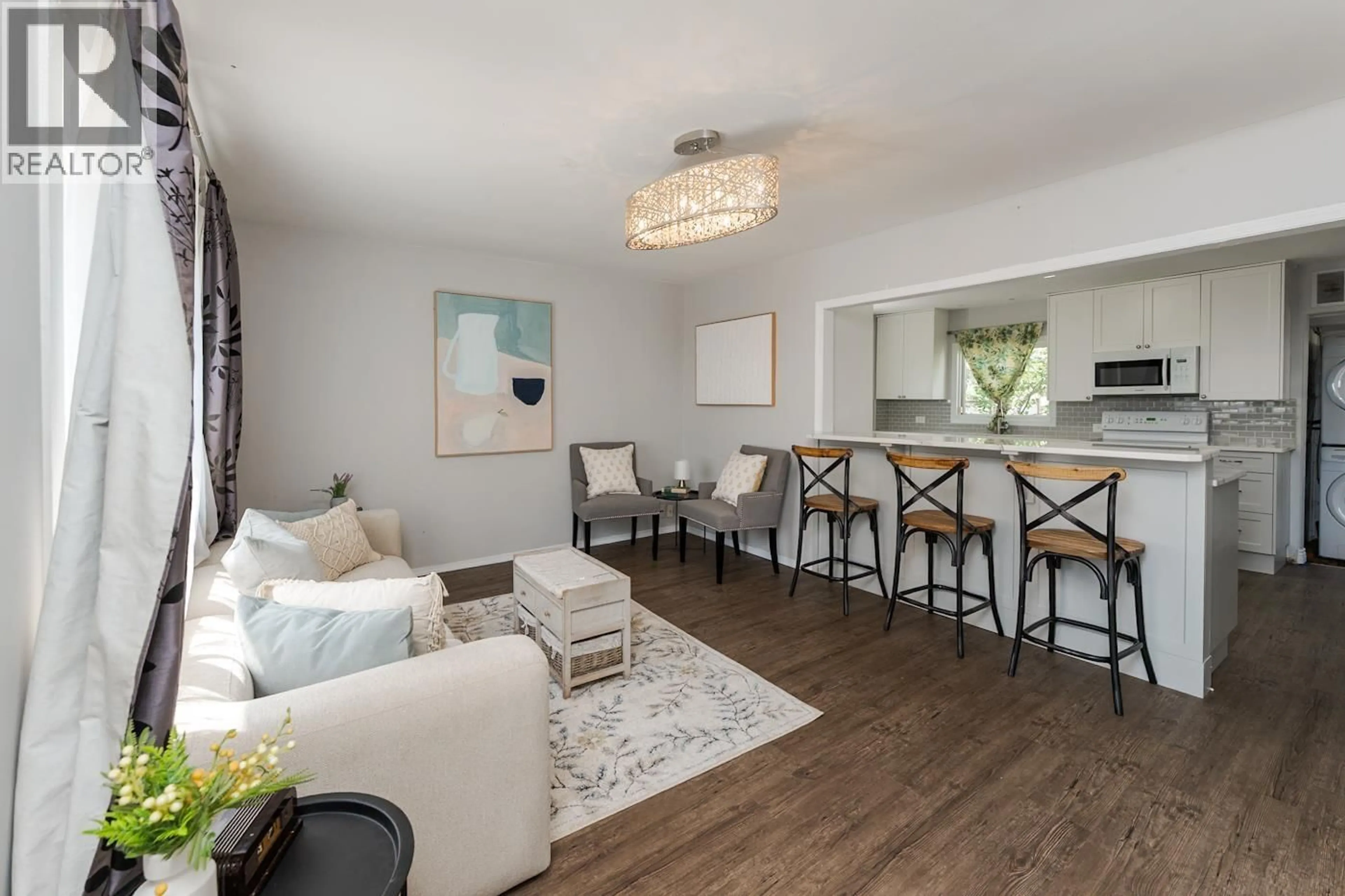 Living room with furniture, wood/laminate floor for 737 IRWIN STREET, Prince George British Columbia V2M2X6