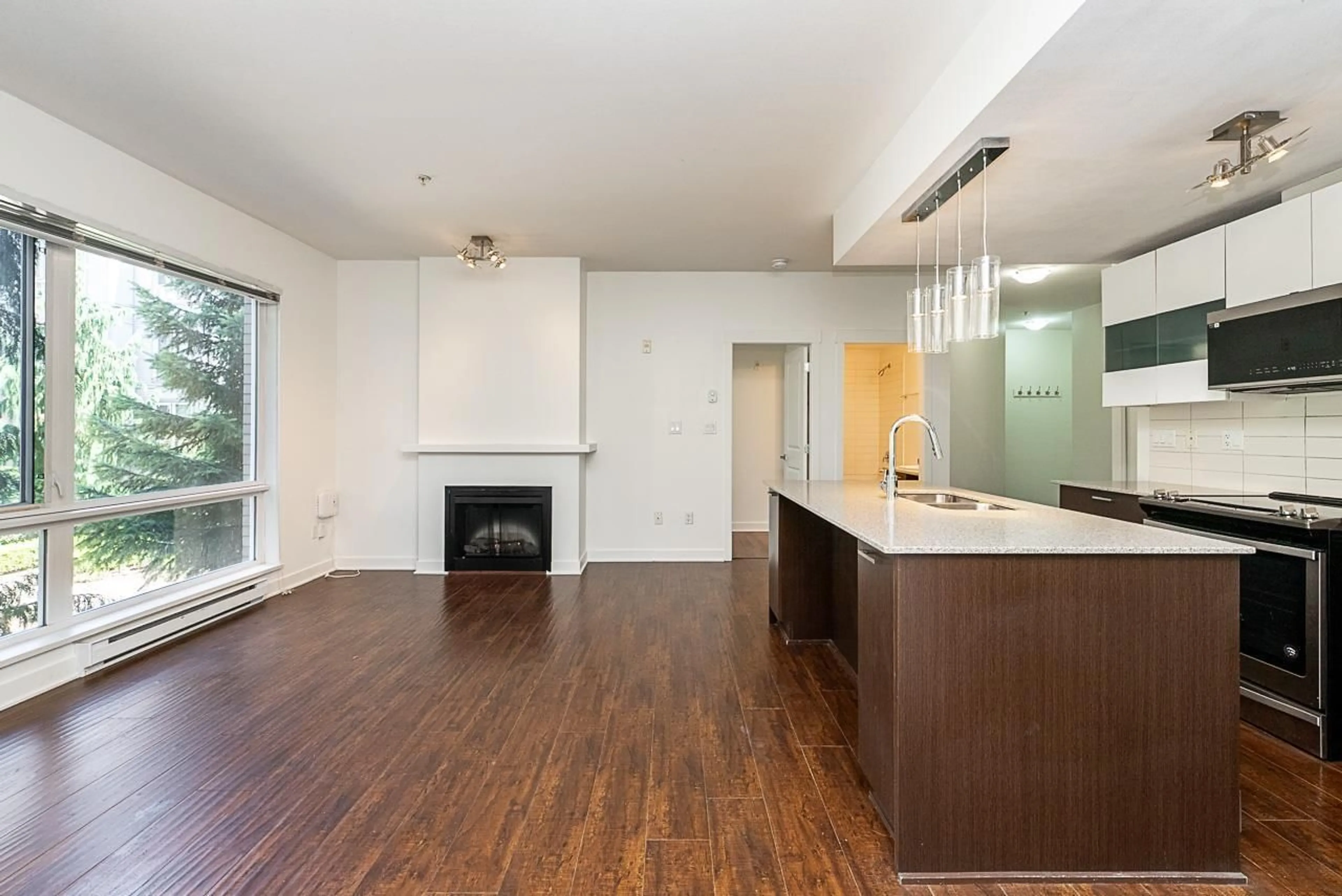 Open concept kitchen, wood/laminate floor for 216 - 13339 102A AVENUE, Surrey British Columbia V3T0C5