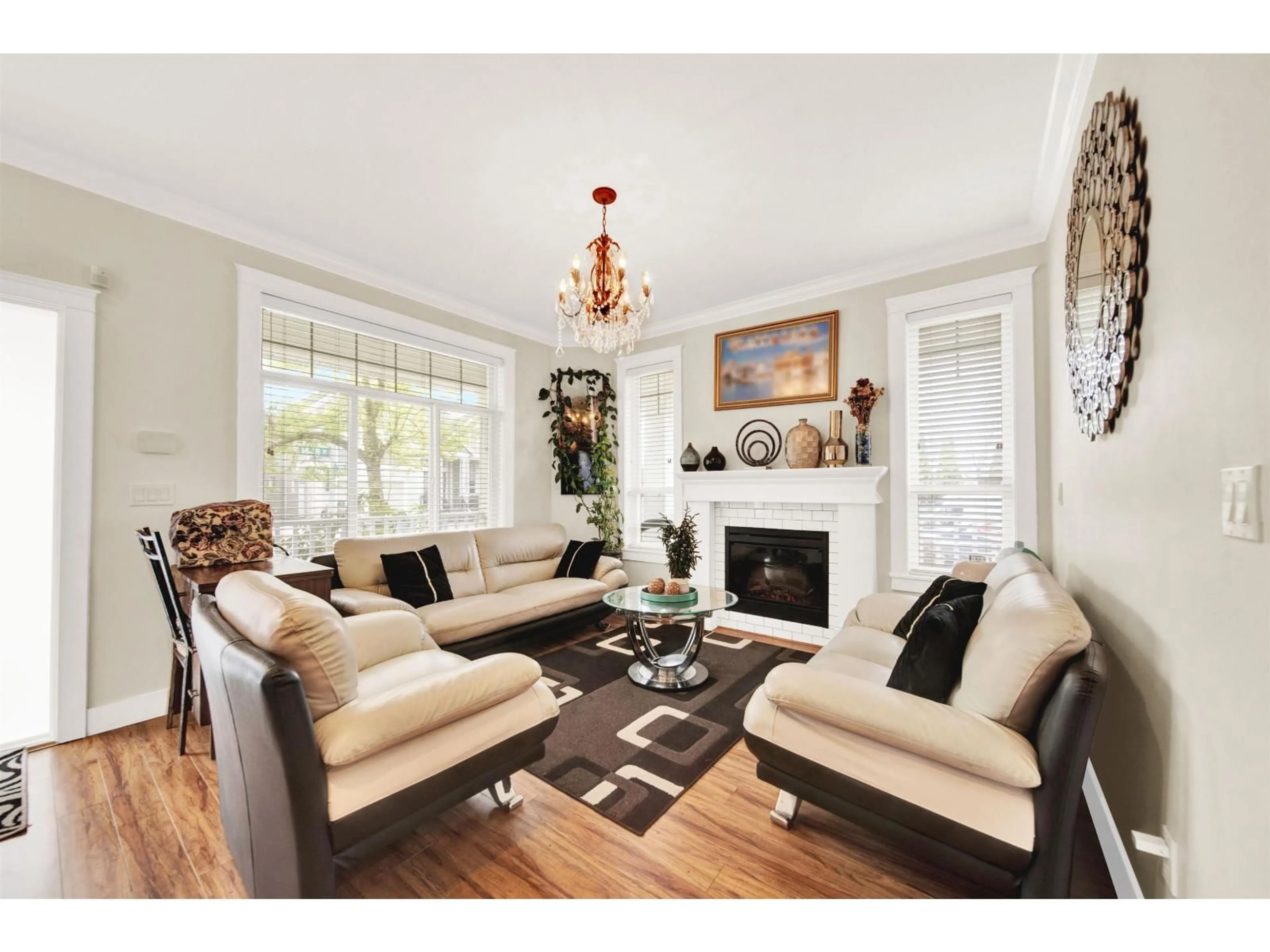 Living room with furniture, wood/laminate floor for 7051 144B STREET, Surrey British Columbia V3S8H4