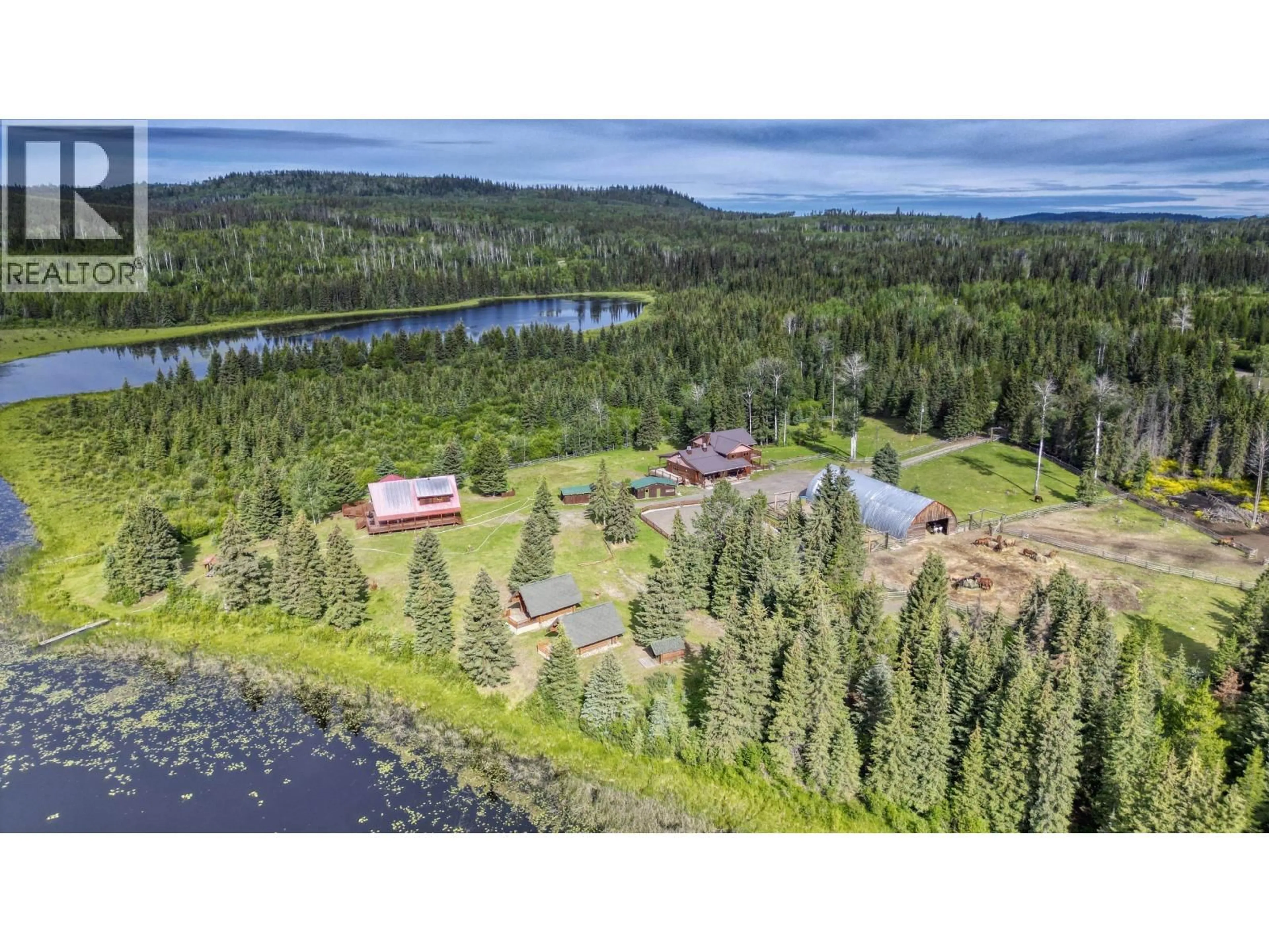 A pic from outside/outdoor area/front of a property/back of a property/a pic from drone, water/lake/river/ocean view for 9550 EAGAN LAKE ROAD, Bridge Lake British Columbia V0K1E0