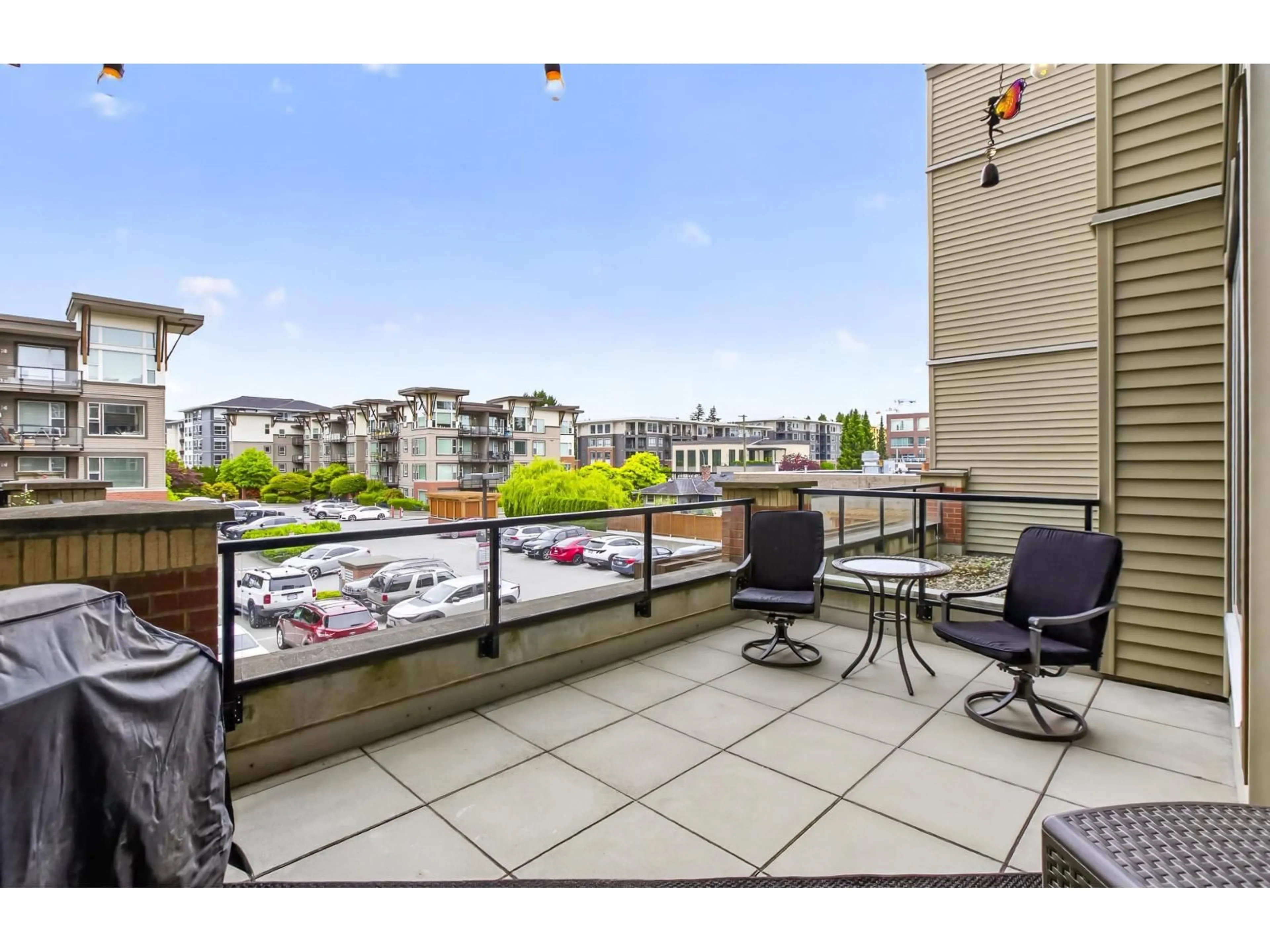 Patio, city buildings view from balcony for 215 - 1975 MCCALLUM ROAD, Abbotsford British Columbia V2S3N3