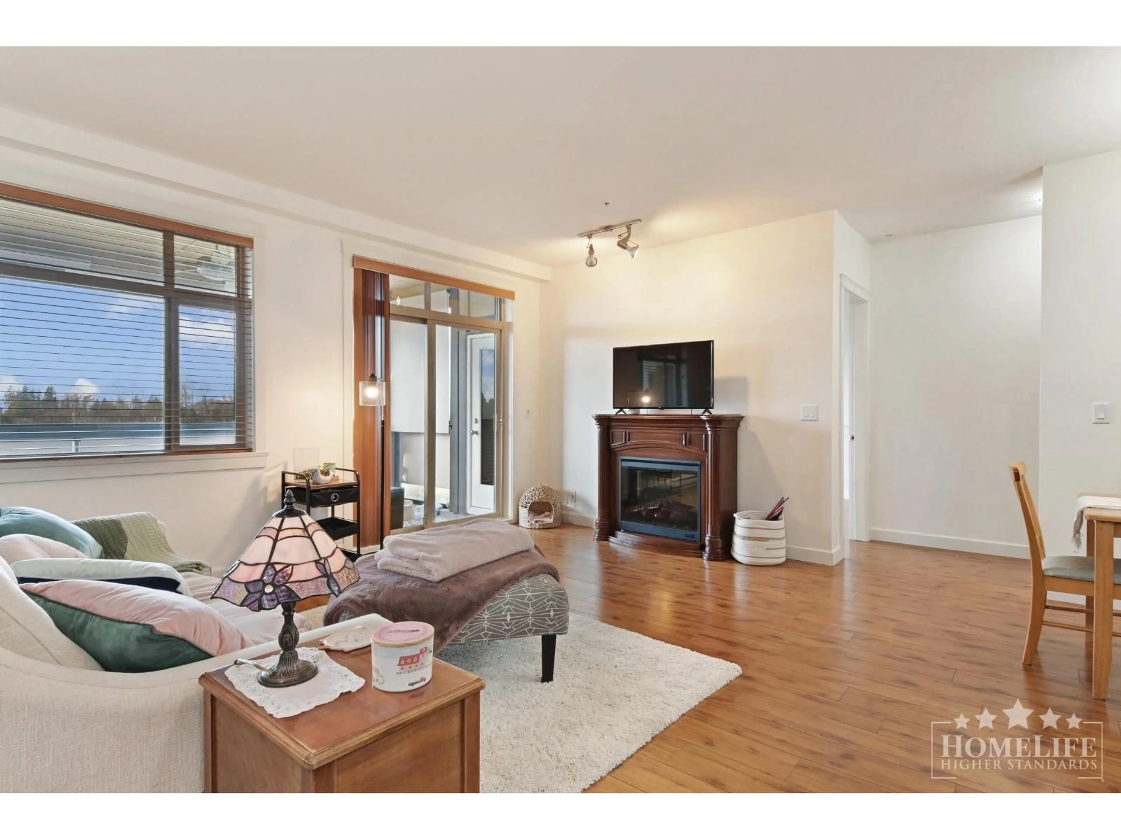 Living room with furniture, wood/laminate floor for 528 - 8067 207 STREET, Langley British Columbia V2Y0P1
