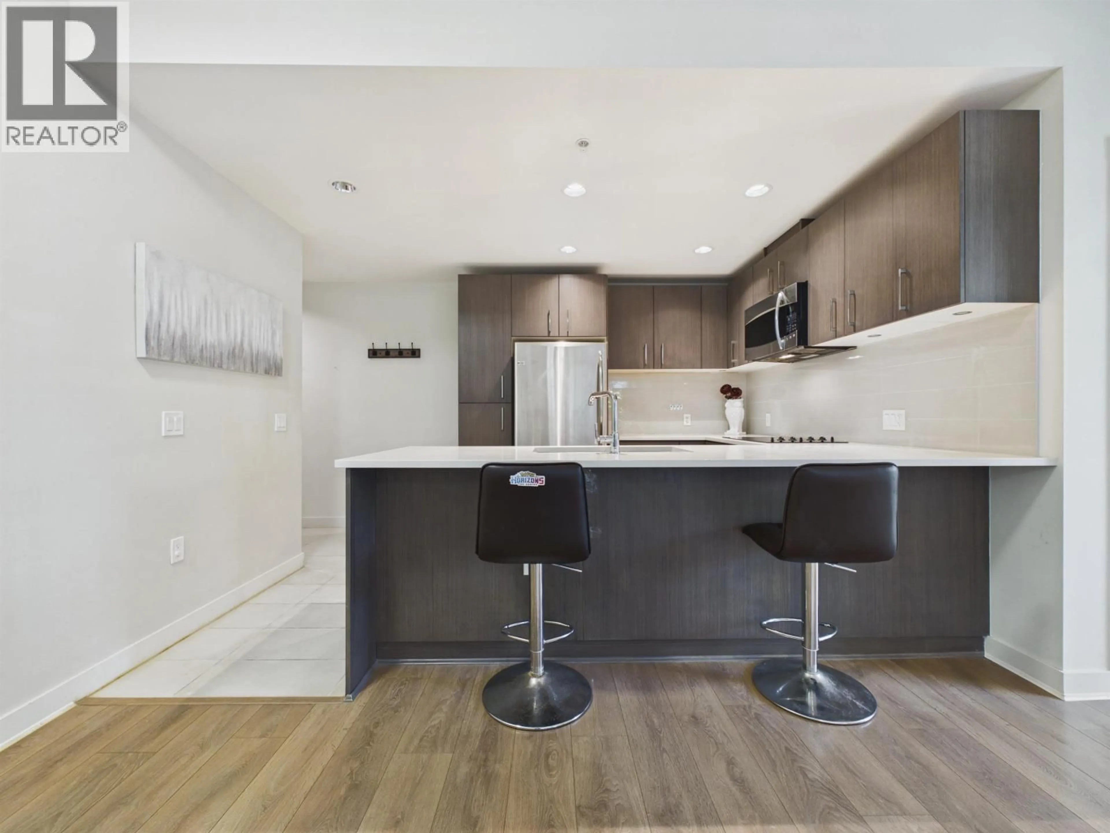 Open concept kitchen, wood/laminate floor for 213 - 5983 GRAY AVENUE, Vancouver British Columbia V6S0G8