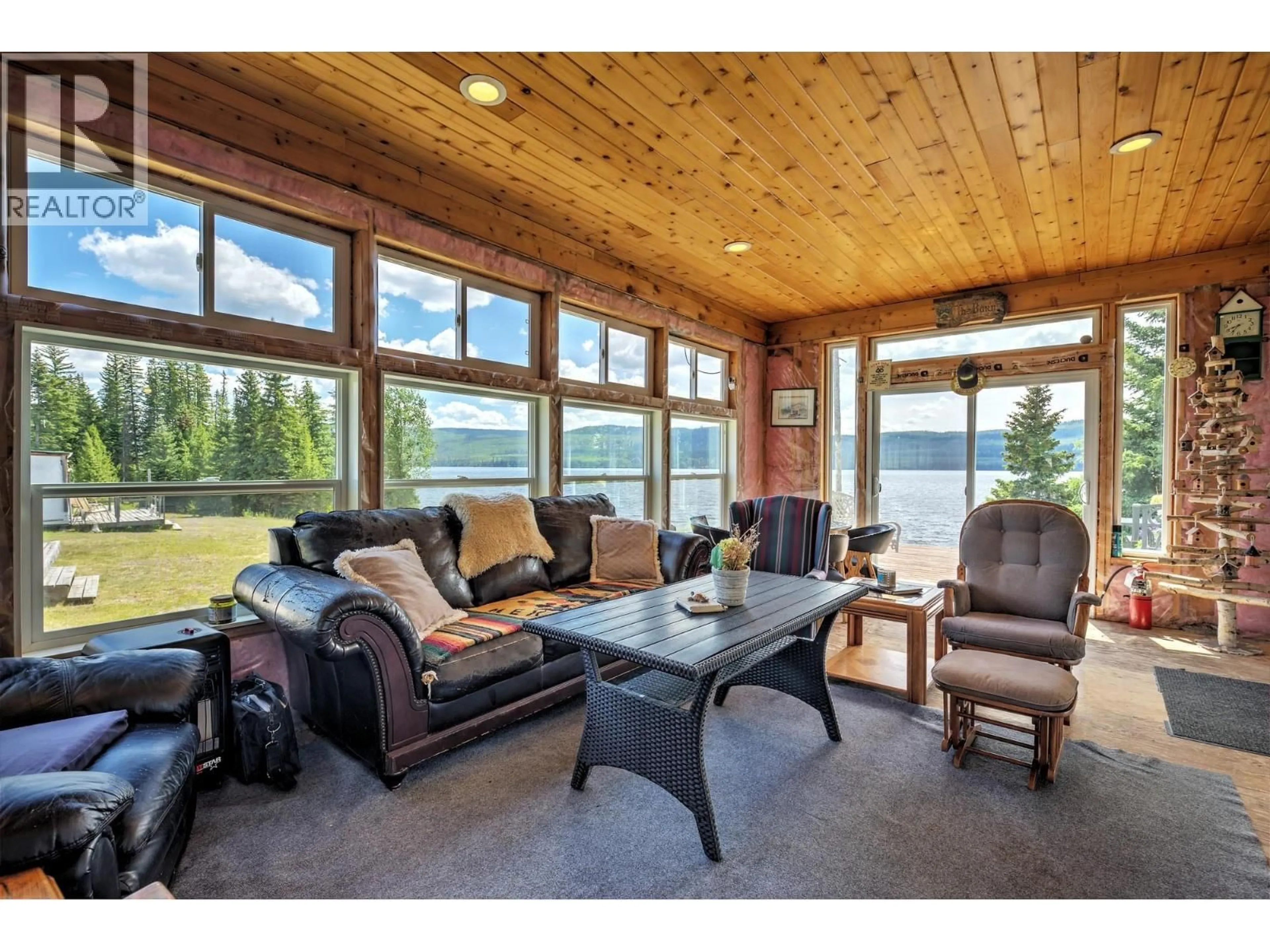 Living room with furniture, wood/laminate floor for 9888 BONAPARTE SPUR FOREST SERVICE ROAD, Bridge Lake British Columbia V0K1E0