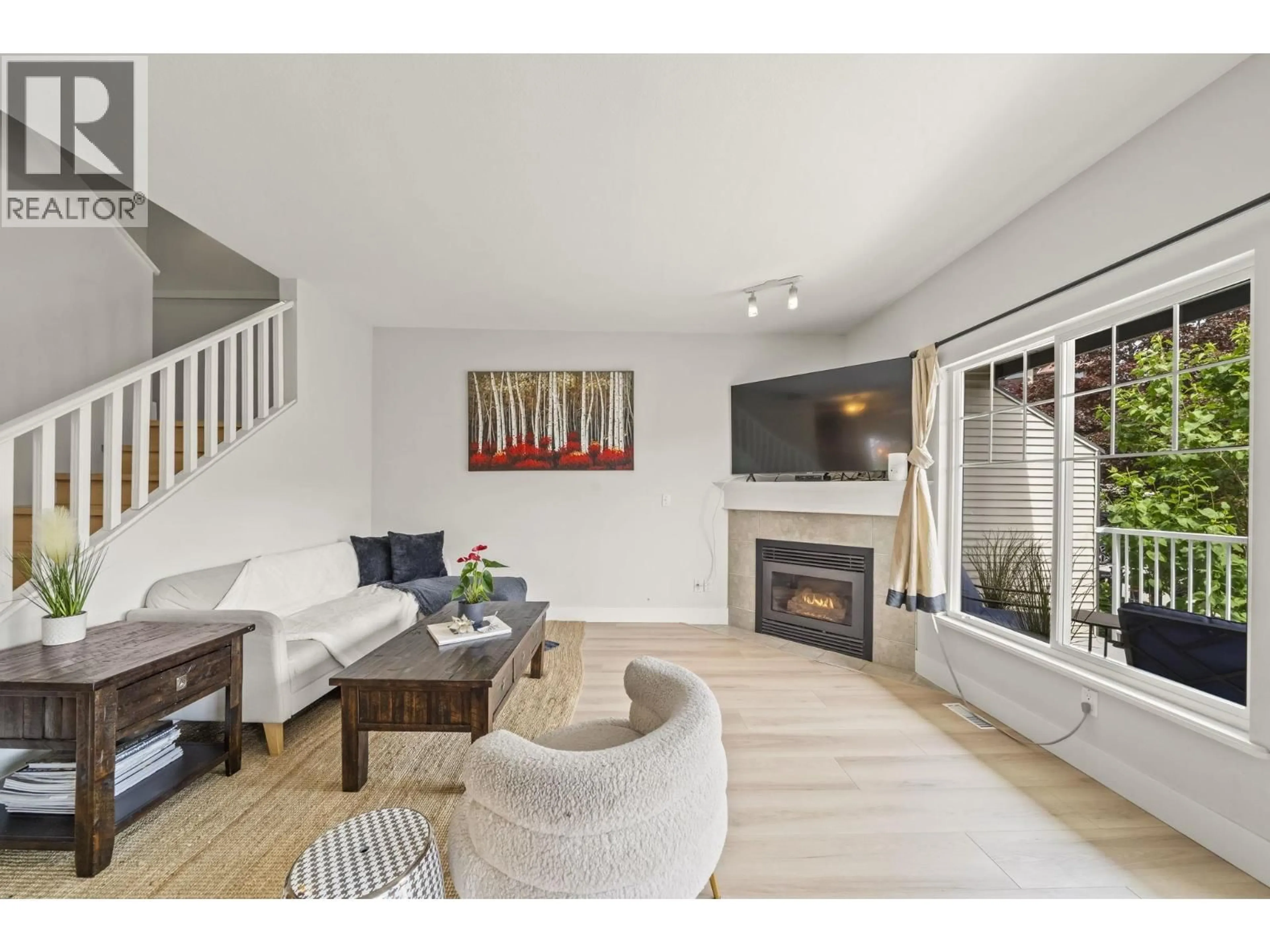 Living room with furniture, wood/laminate floor for 12 - 1765 PADDOCK DRIVE, Coquitlam British Columbia V3E3J1