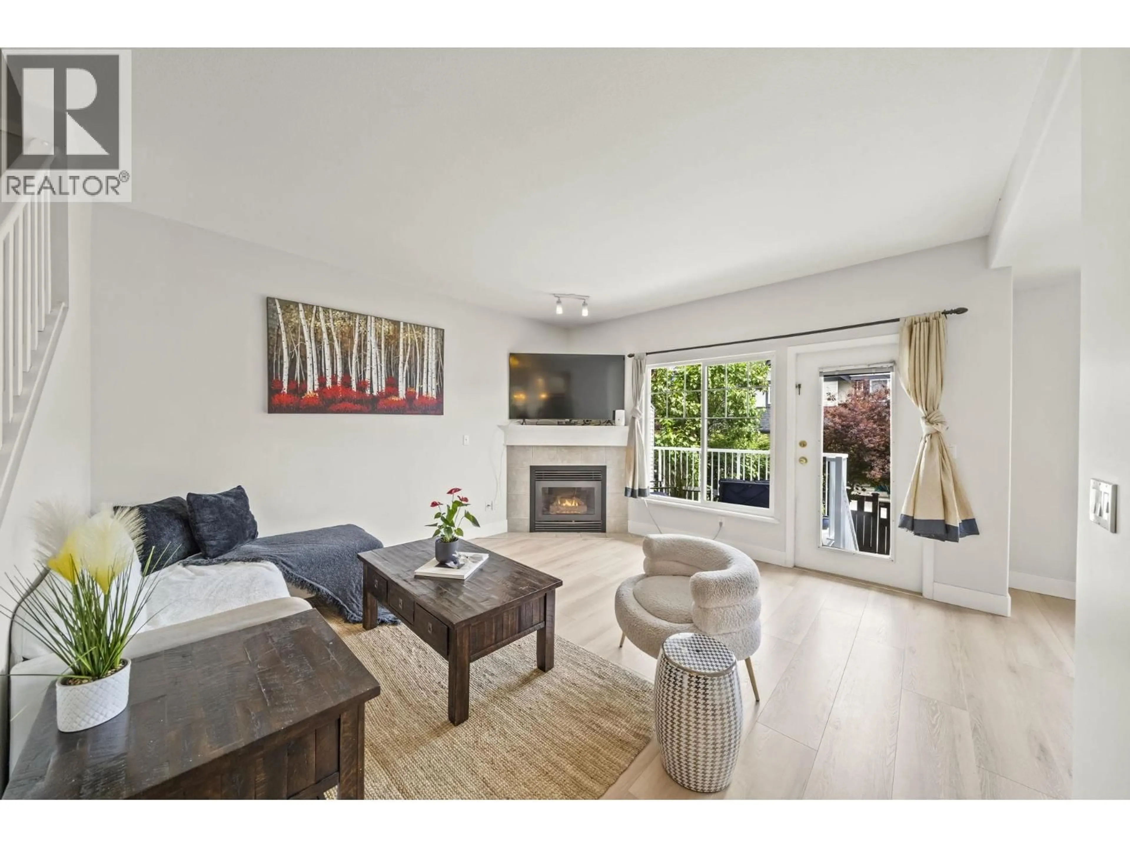 Living room with furniture, wood/laminate floor for 12 - 1765 PADDOCK DRIVE, Coquitlam British Columbia V3E3J1