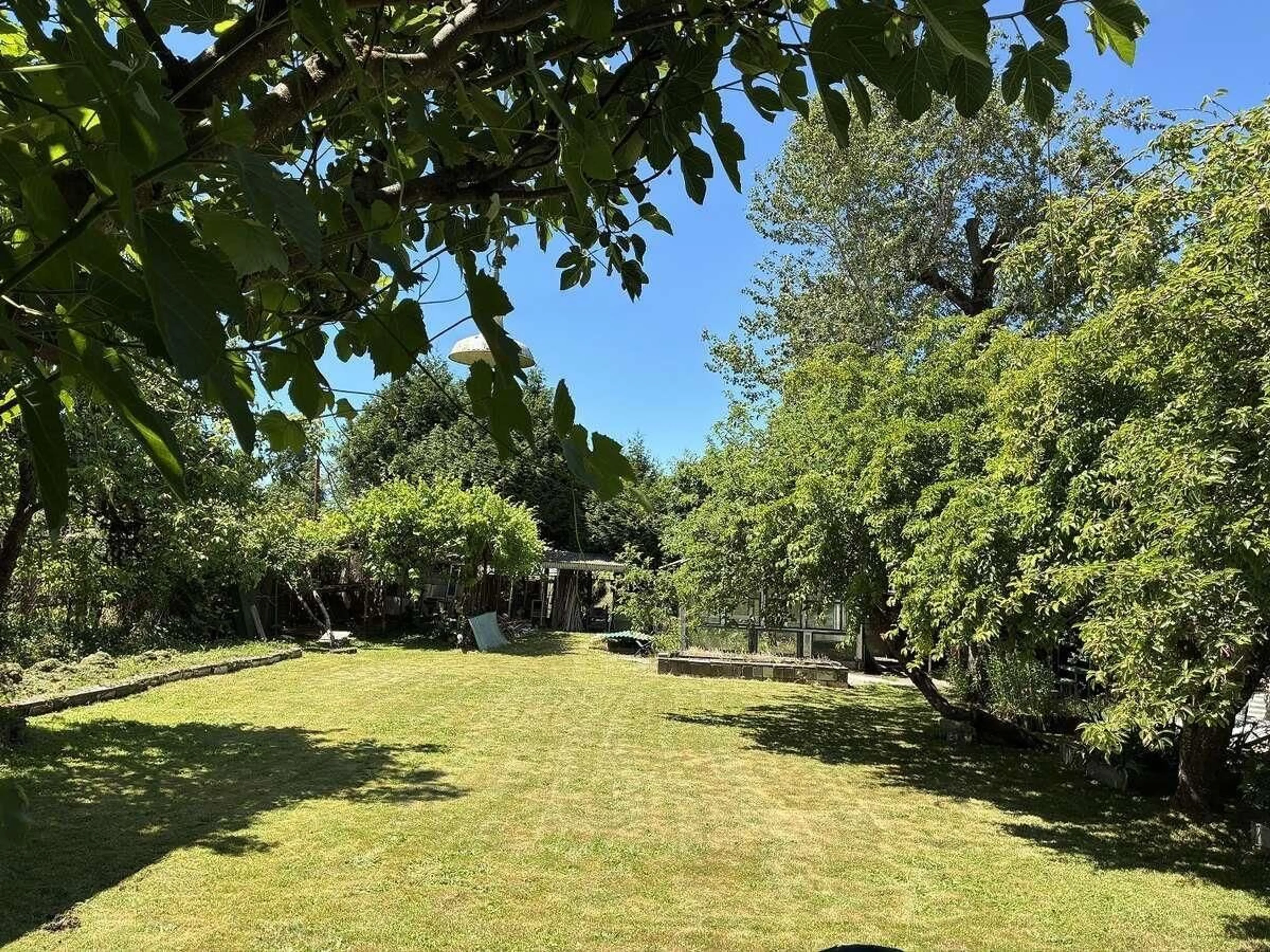 A pic from outside/outdoor area/front of a property/back of a property/a pic from drone, forest/trees view for 9045 116 STREET, Delta British Columbia V4C5W8