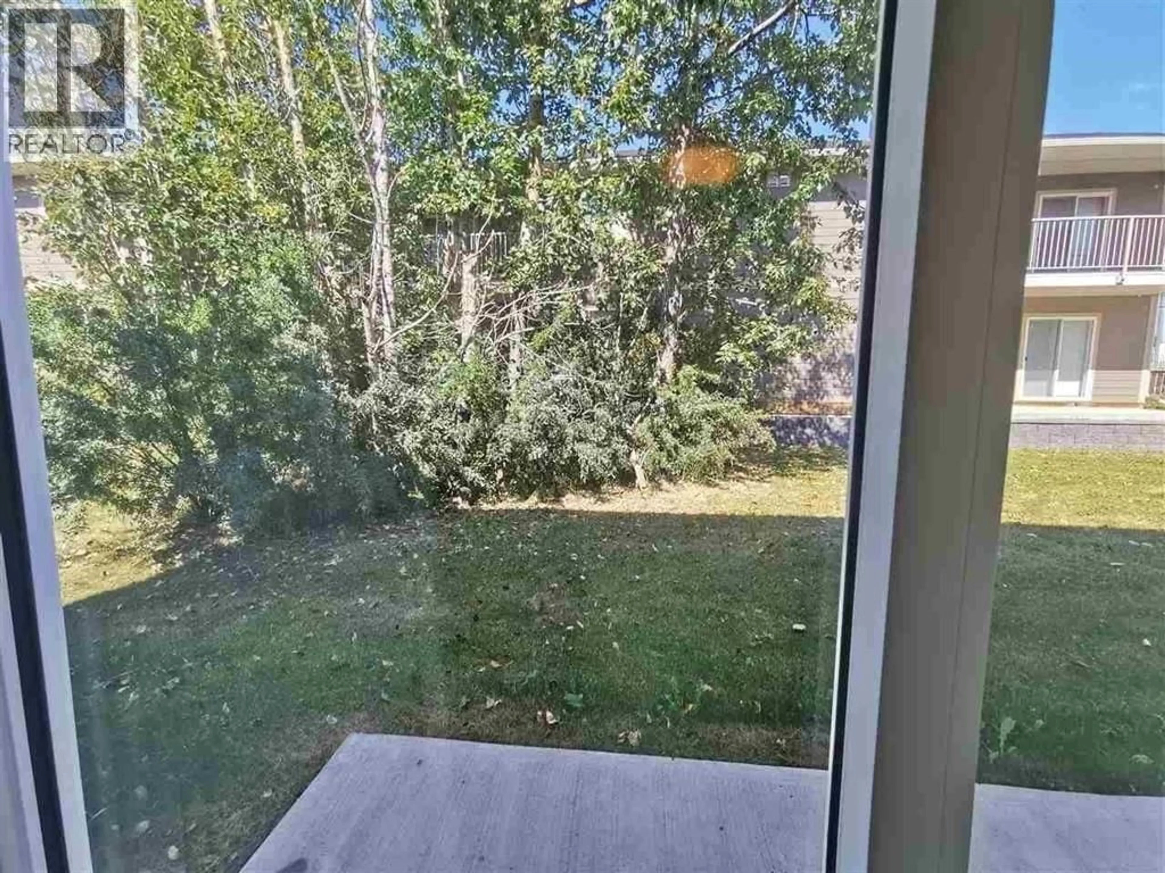 Patio, forest/trees view for 4 - 10223 98 AVENUE, Fort St. John British Columbia V1J0B1
