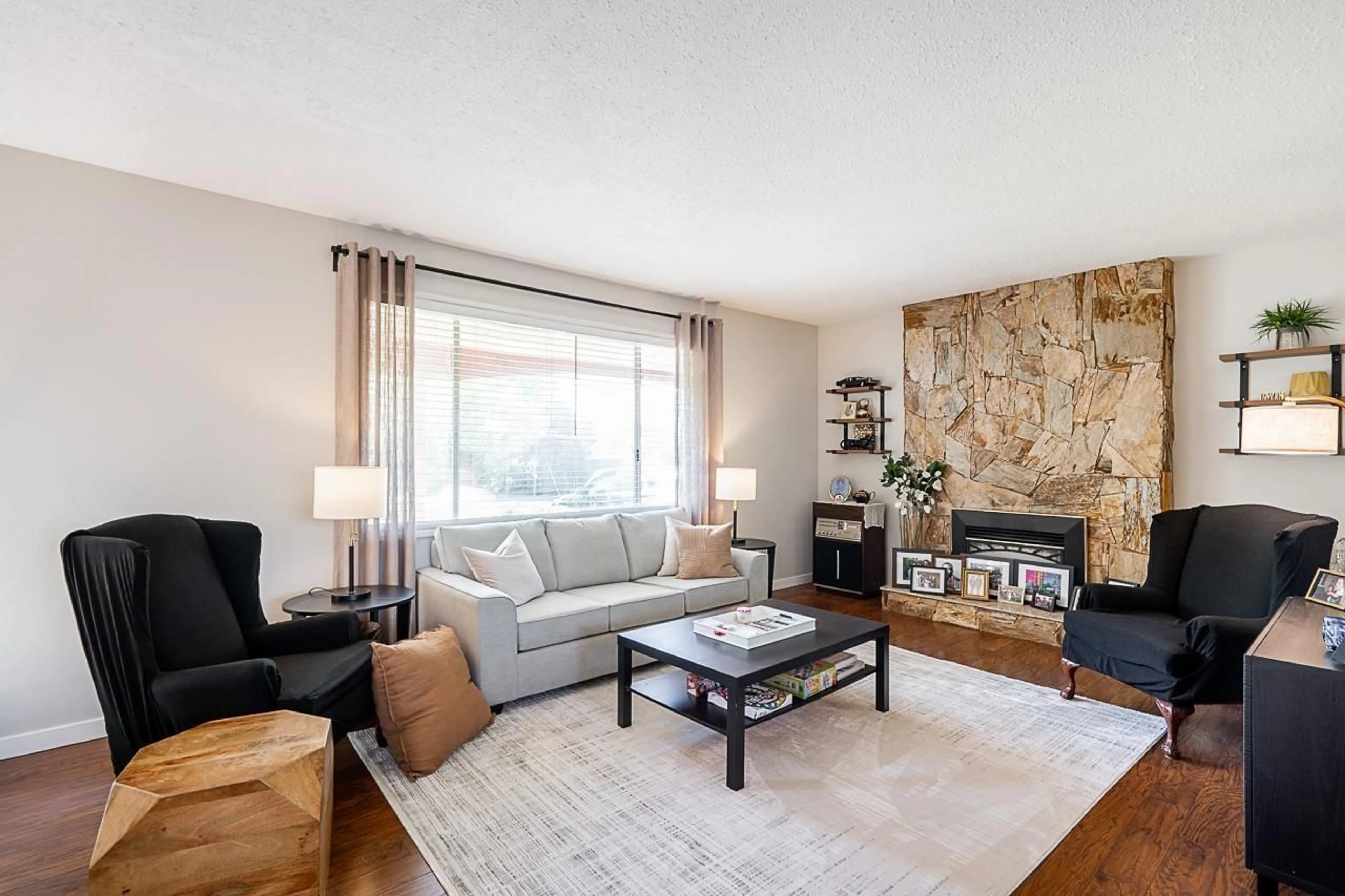 Living room with furniture, wood/laminate floor for 4628 207A STREET, Langley British Columbia V3A5N3