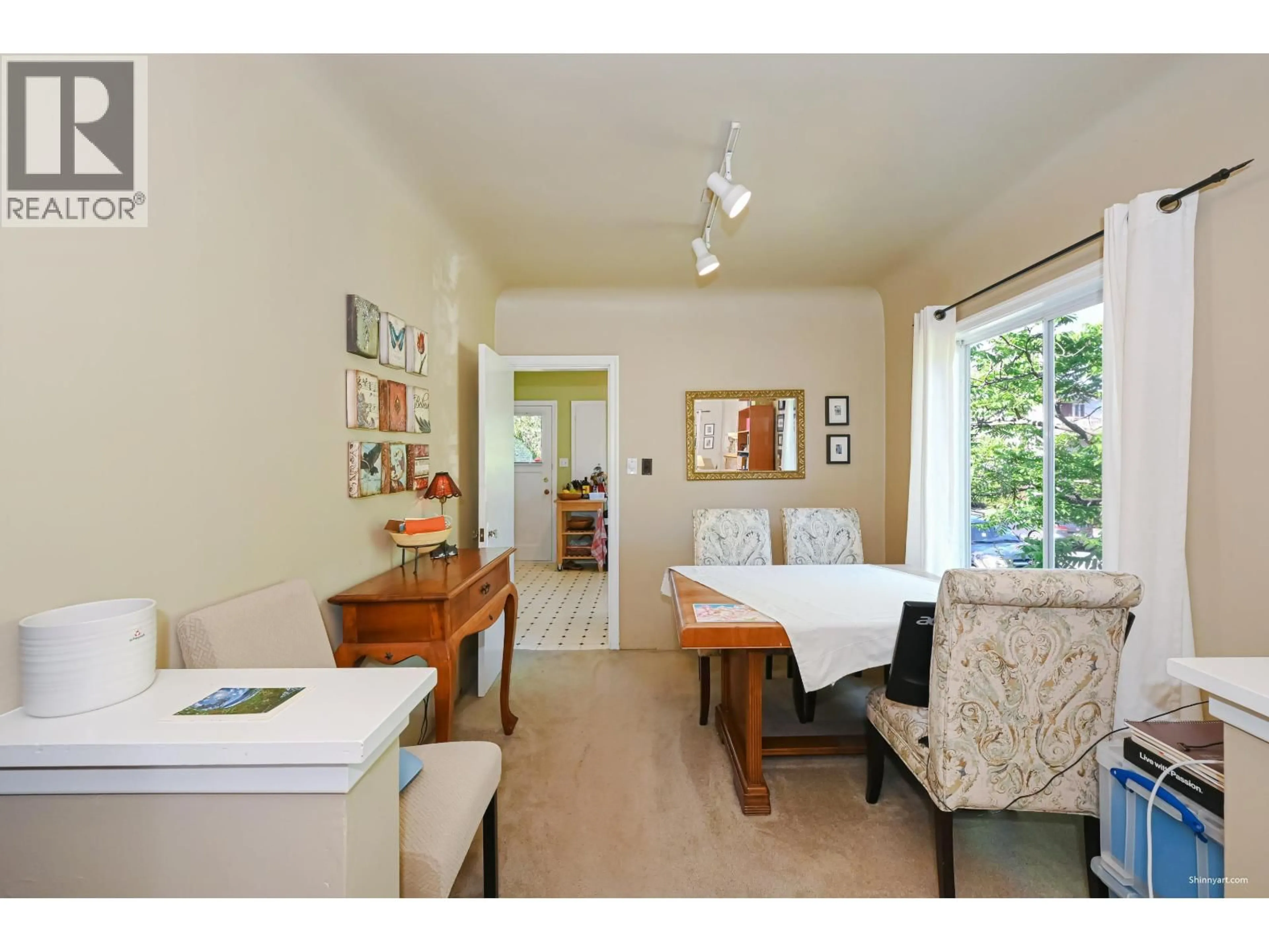 Dining room, wood/laminate floor for 3305 6TH AVENUE, Vancouver British Columbia V6R1T2