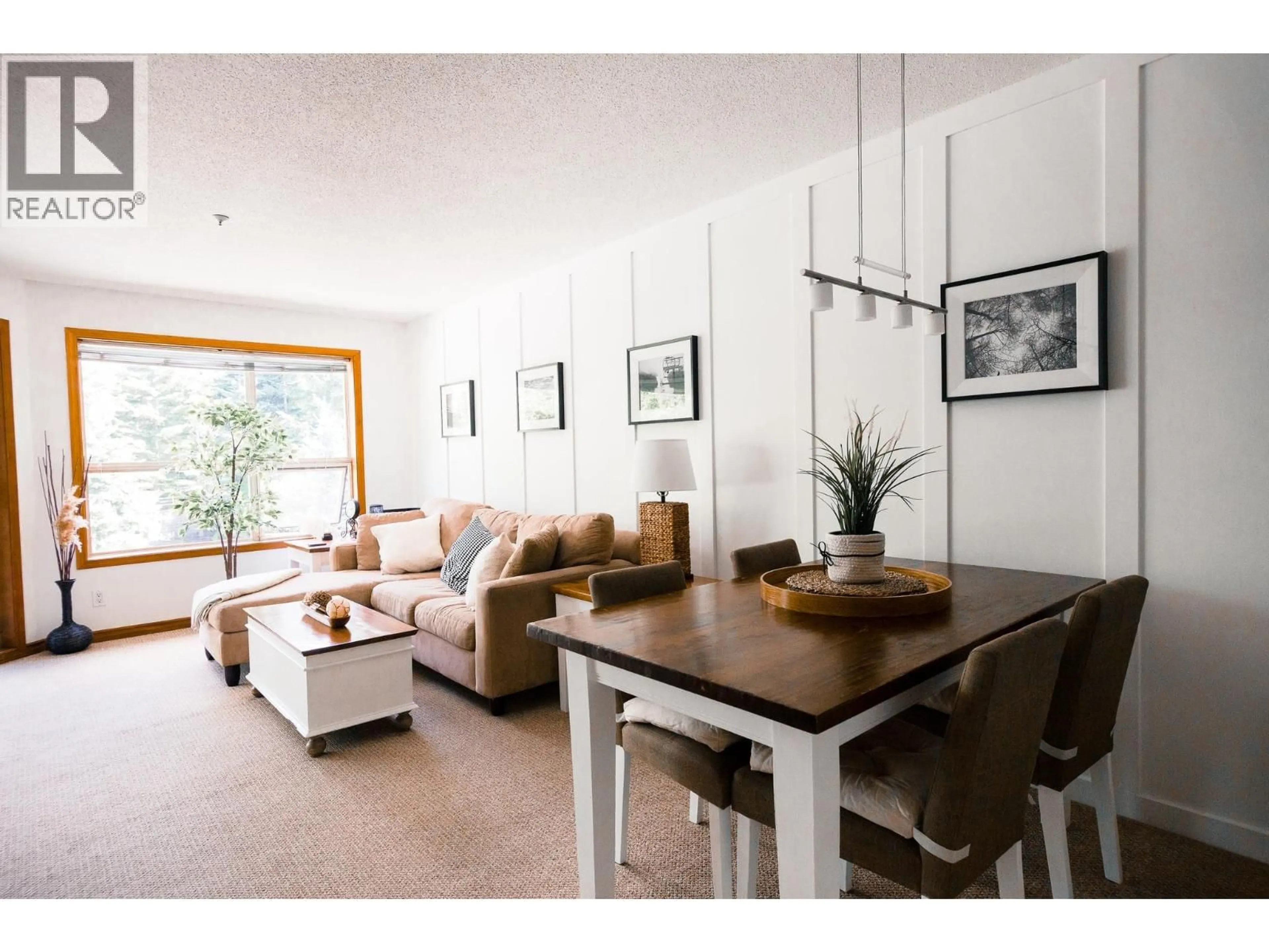 Living room with furniture, wood/laminate floor for 334 - 4800 SPEARHEAD DRIVE, Whistler British Columbia V8E1G1
