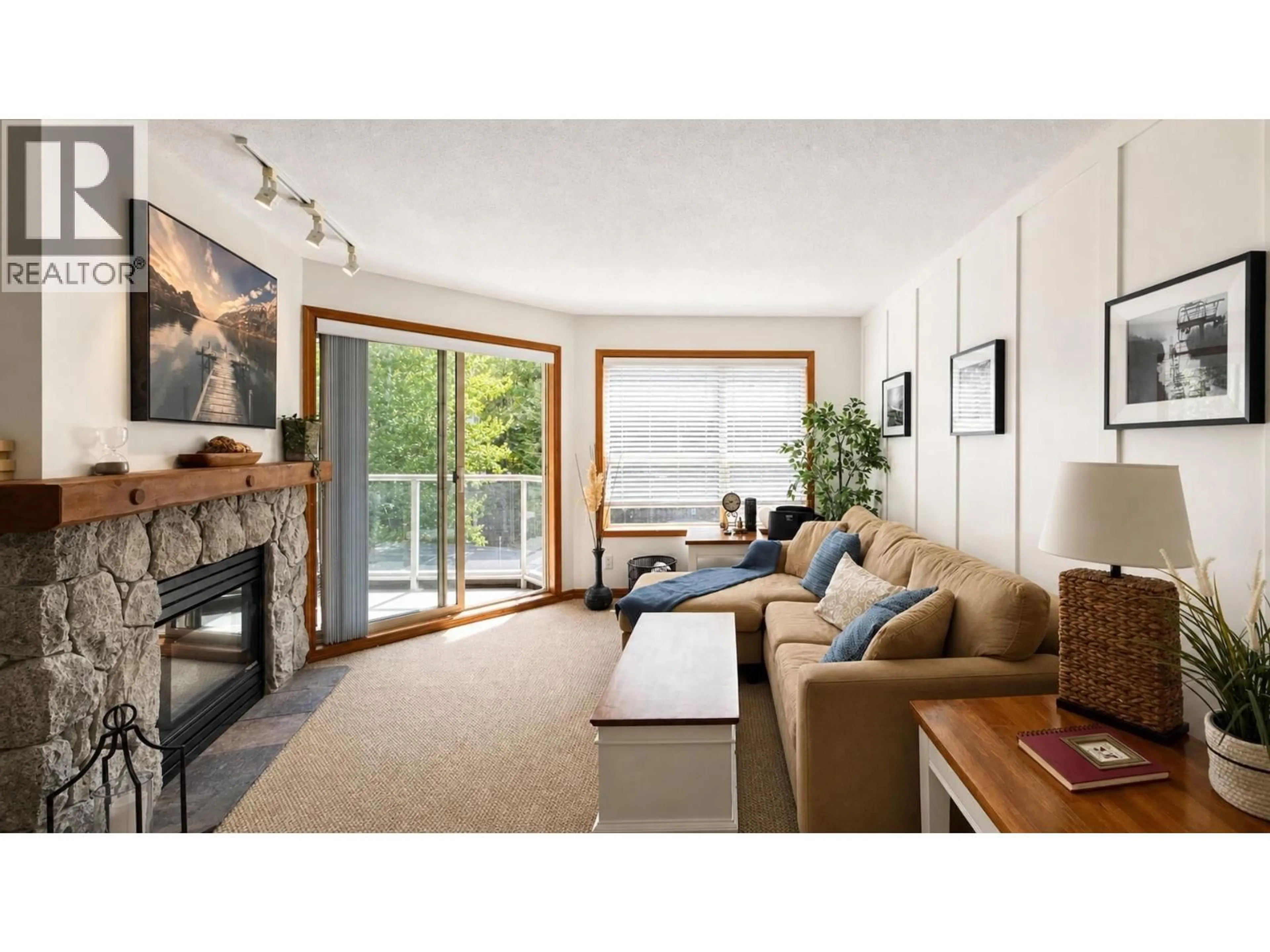 Living room with furniture, wood/laminate floor for 334 - 4800 SPEARHEAD DRIVE, Whistler British Columbia V8E1G1