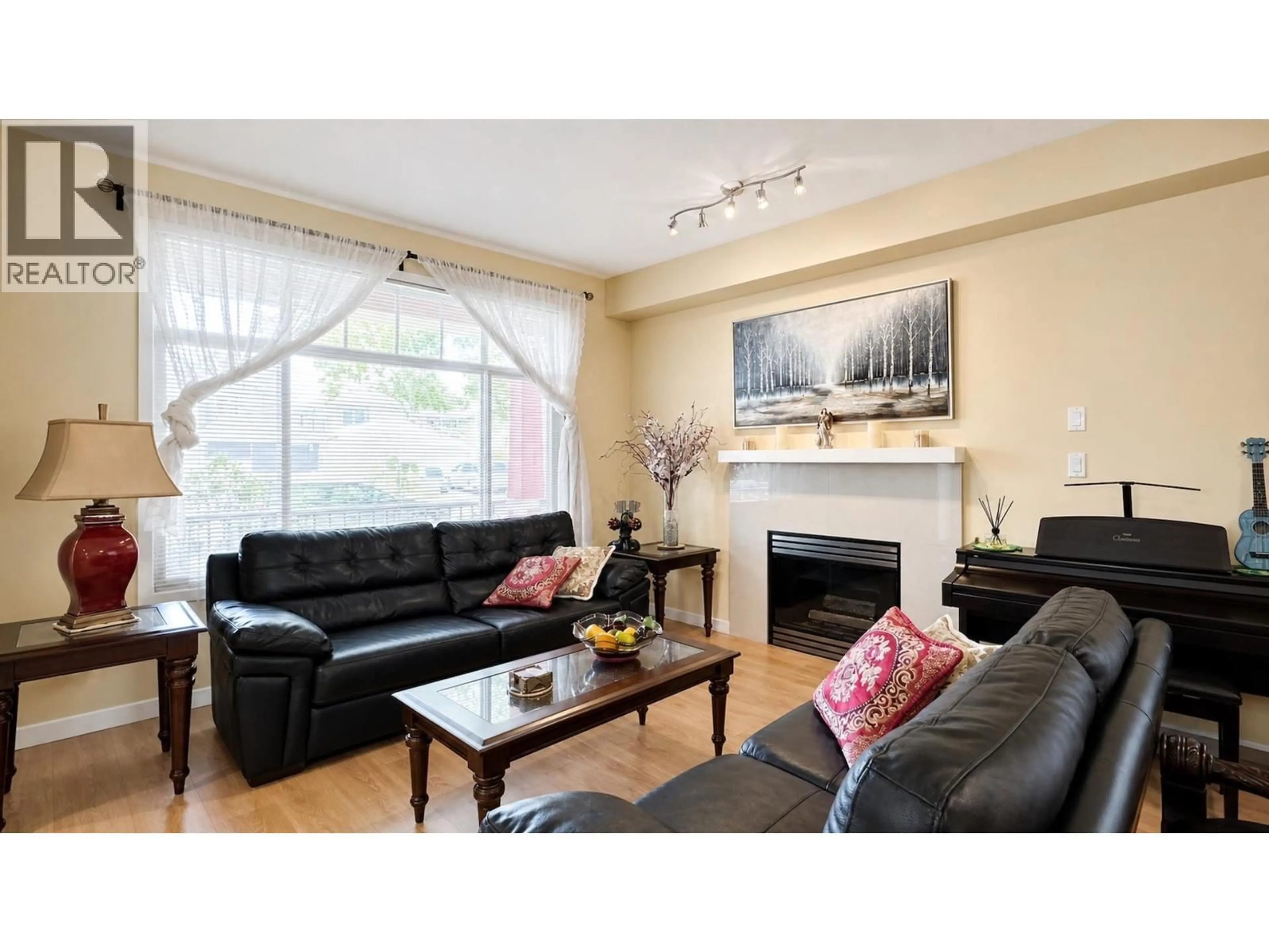 Living room with furniture, wood/laminate floor for 10520 ODLIN ROAD, Richmond British Columbia V6X1E2