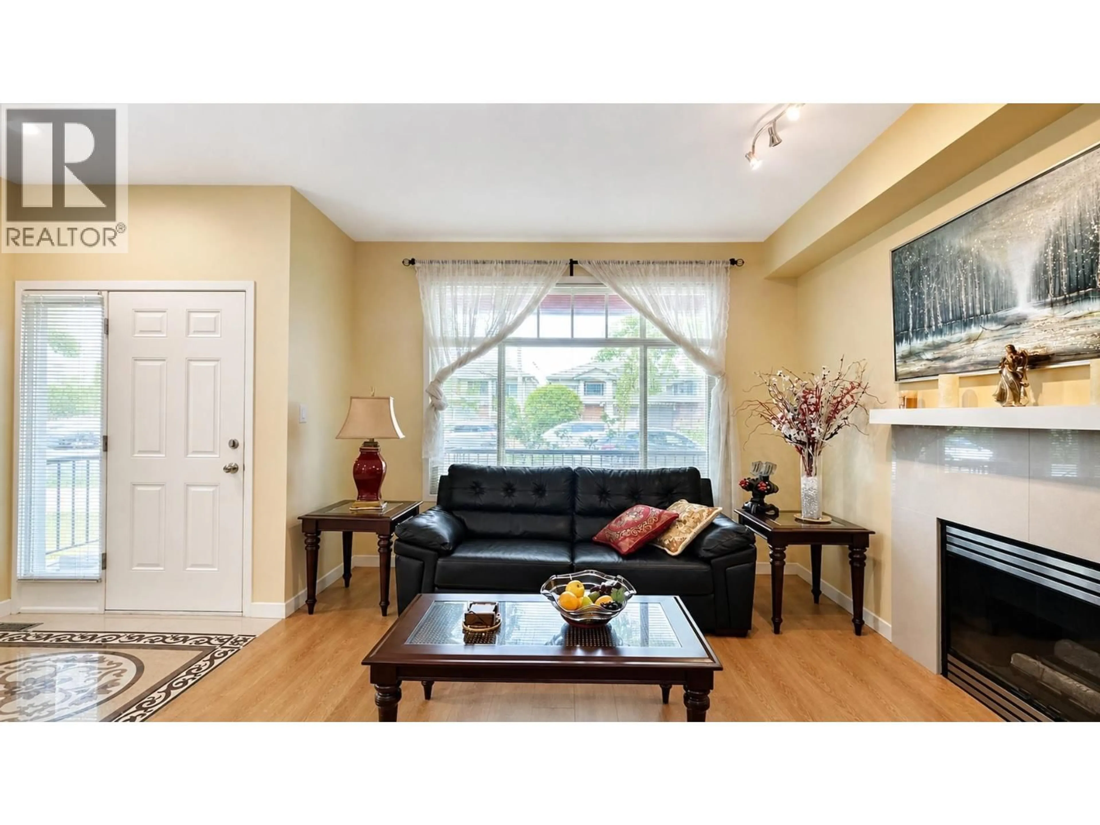 Living room with furniture, wood/laminate floor for 10520 ODLIN ROAD, Richmond British Columbia V6X1E2