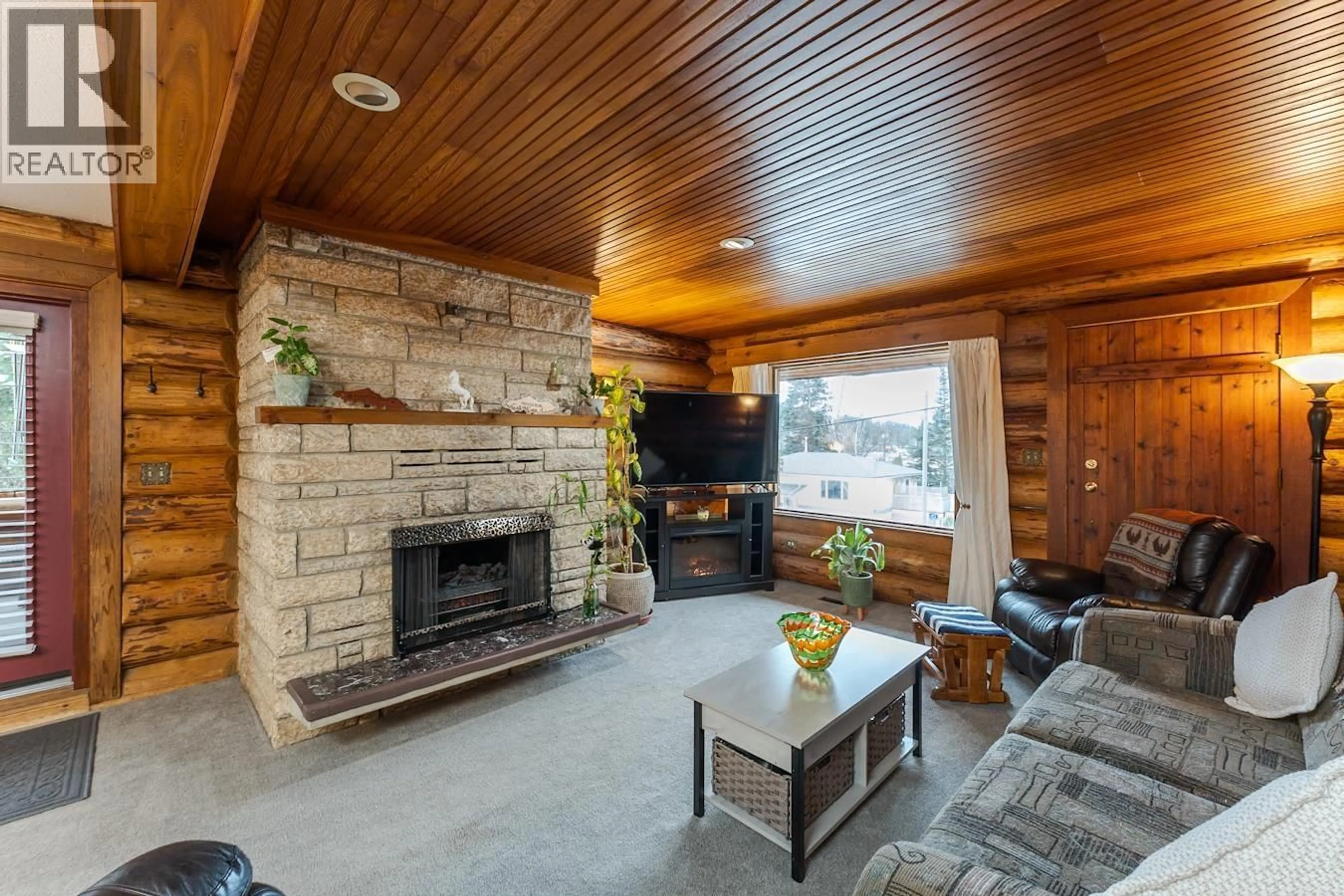 Living room with furniture, wood/laminate floor for 2100 O'KEEFE AVENUE, Prince George British Columbia V2K1K9