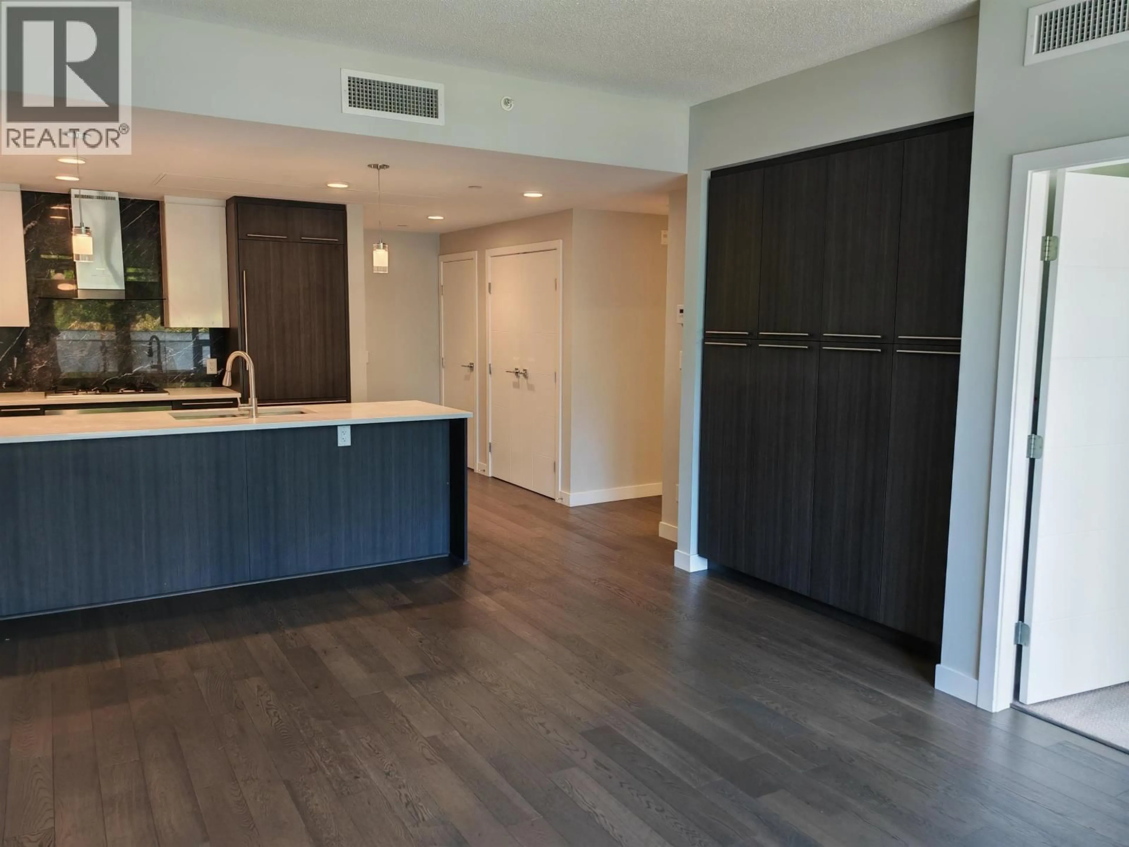 Open concept kitchen, wood/laminate floor for 208 - 5077 CAMBIE STREET, Vancouver British Columbia V5Z0H7