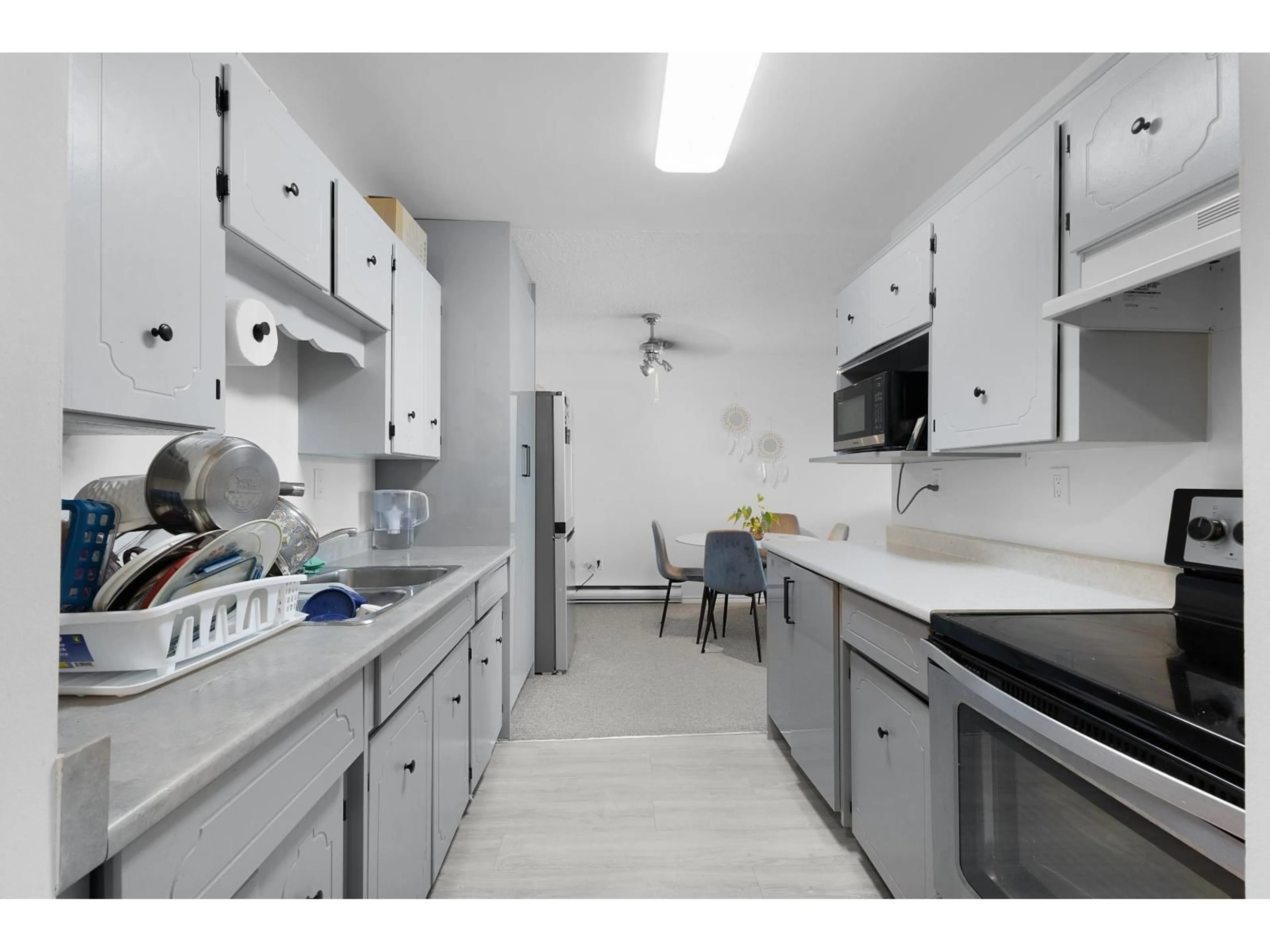 Kitchen with laundary machines, unknown for 205 - 3043 270 STREET, Langley British Columbia V4W3M2