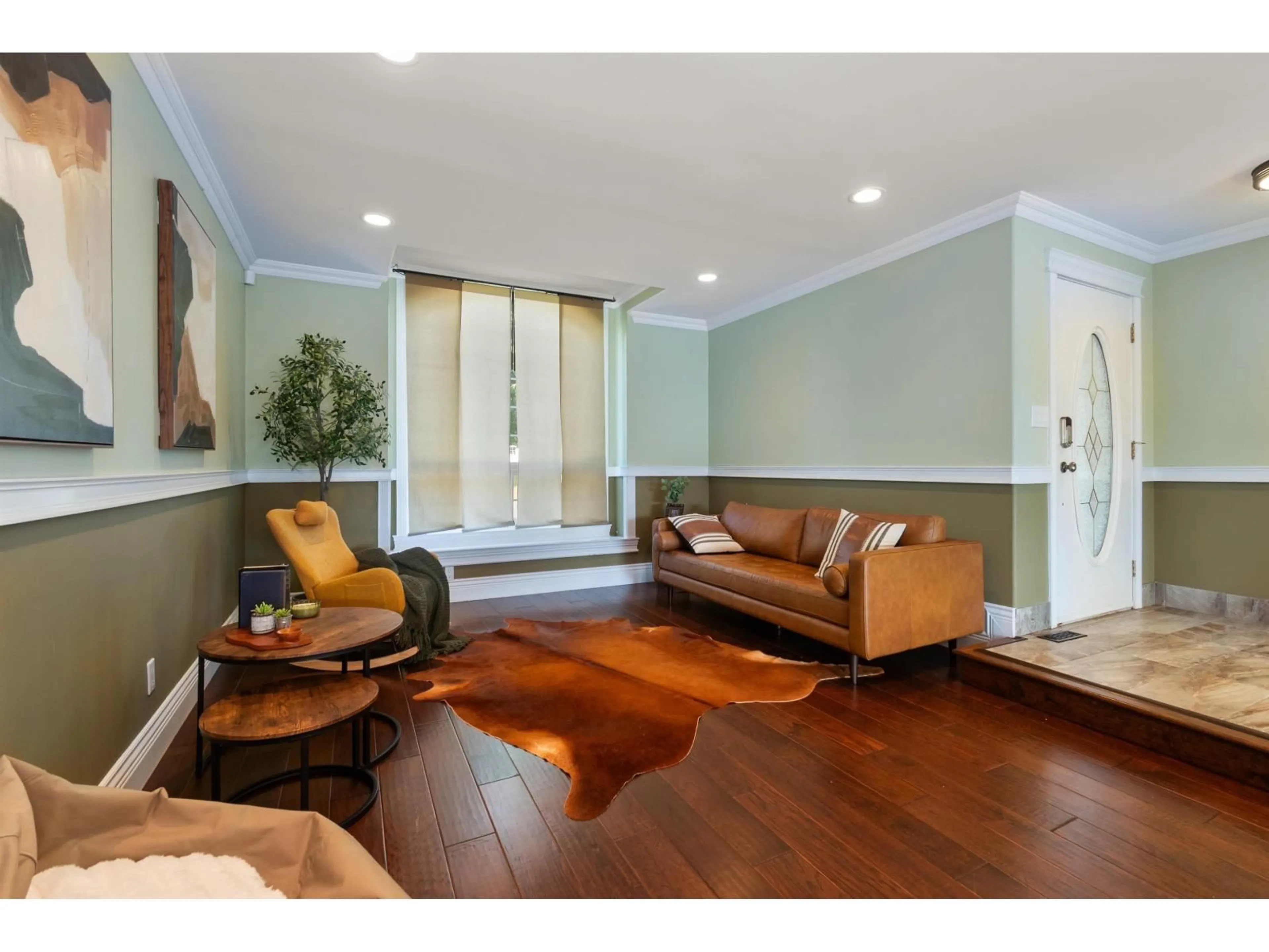 Living room with furniture, wood/laminate floor for 5669 STONEHAVEN STREET, Chilliwack British Columbia V2R3Y6