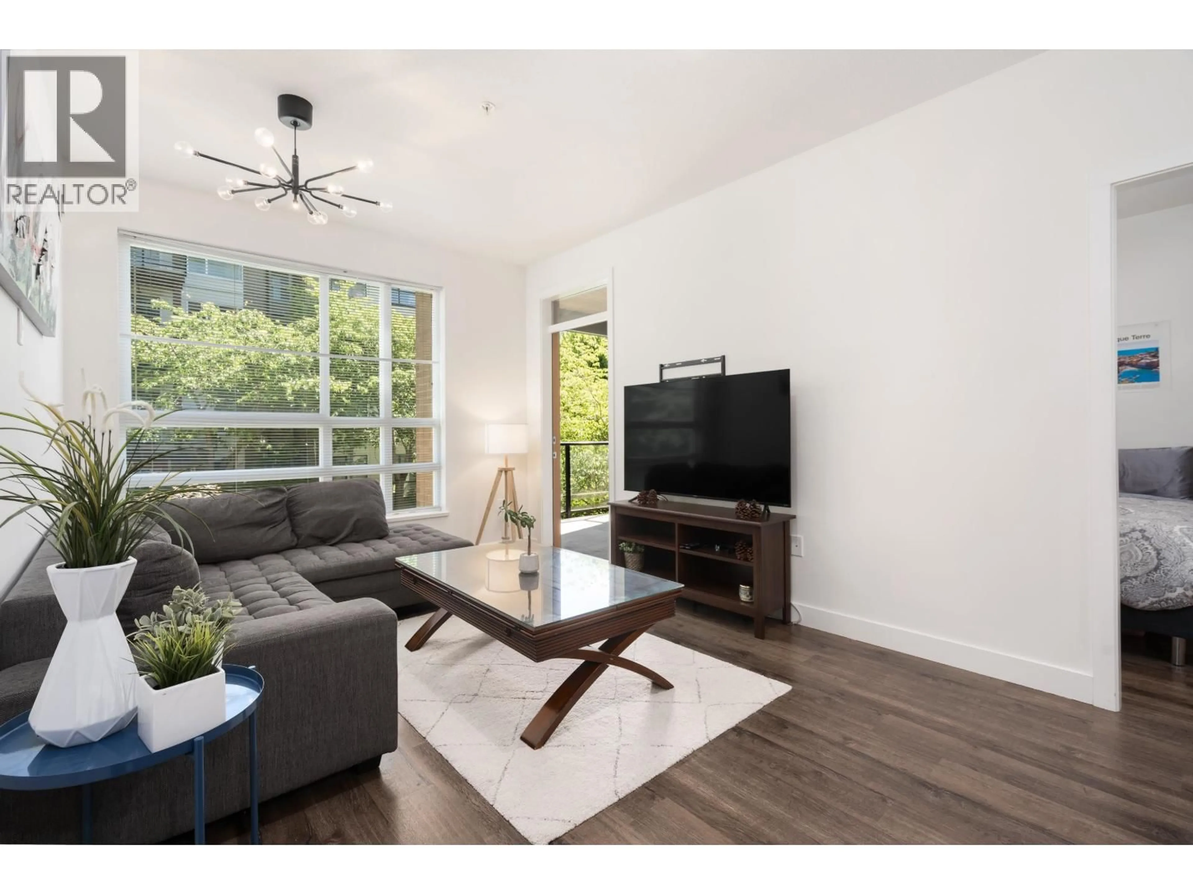 Living room with furniture, wood/laminate floor for 217 - 6033 GRAY AVENUE, Vancouver British Columbia V6S0G3