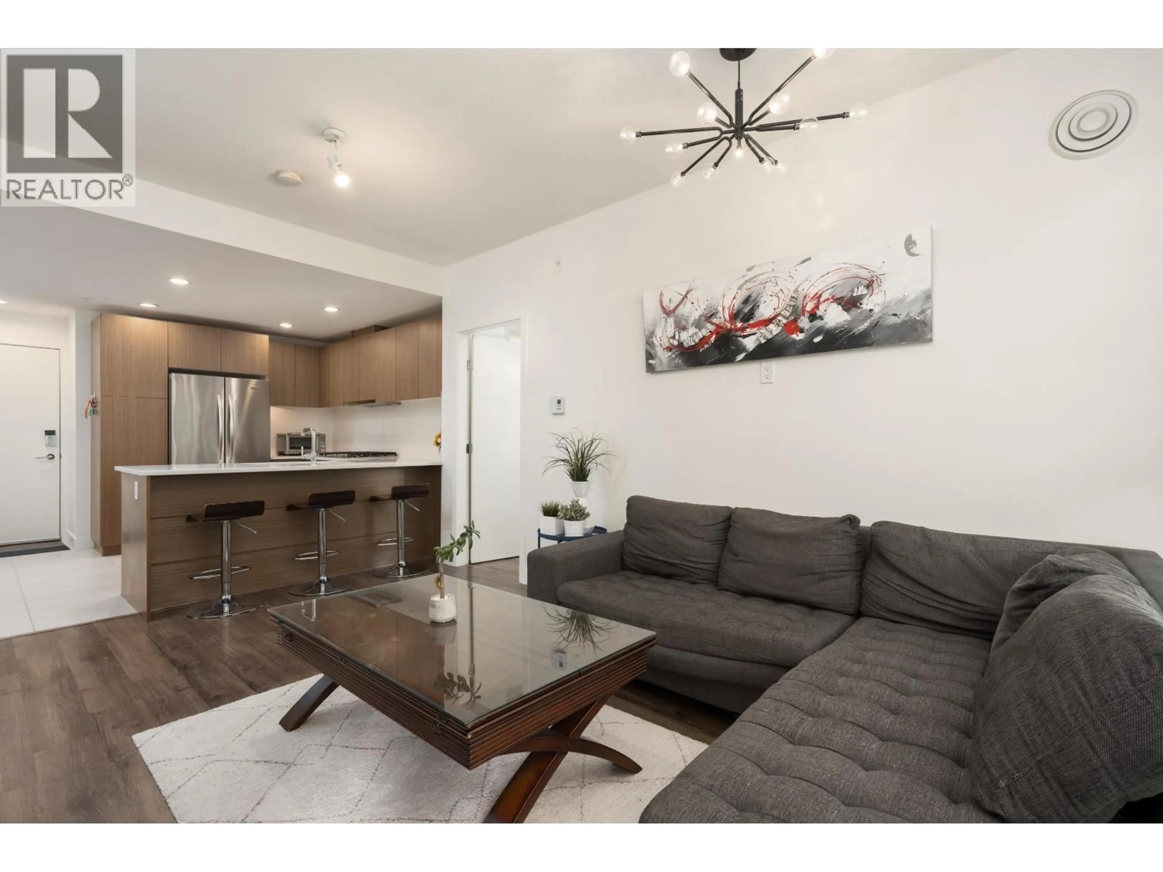 Living room with furniture, wood/laminate floor for 217 - 6033 GRAY AVENUE, Vancouver British Columbia V6S0G3