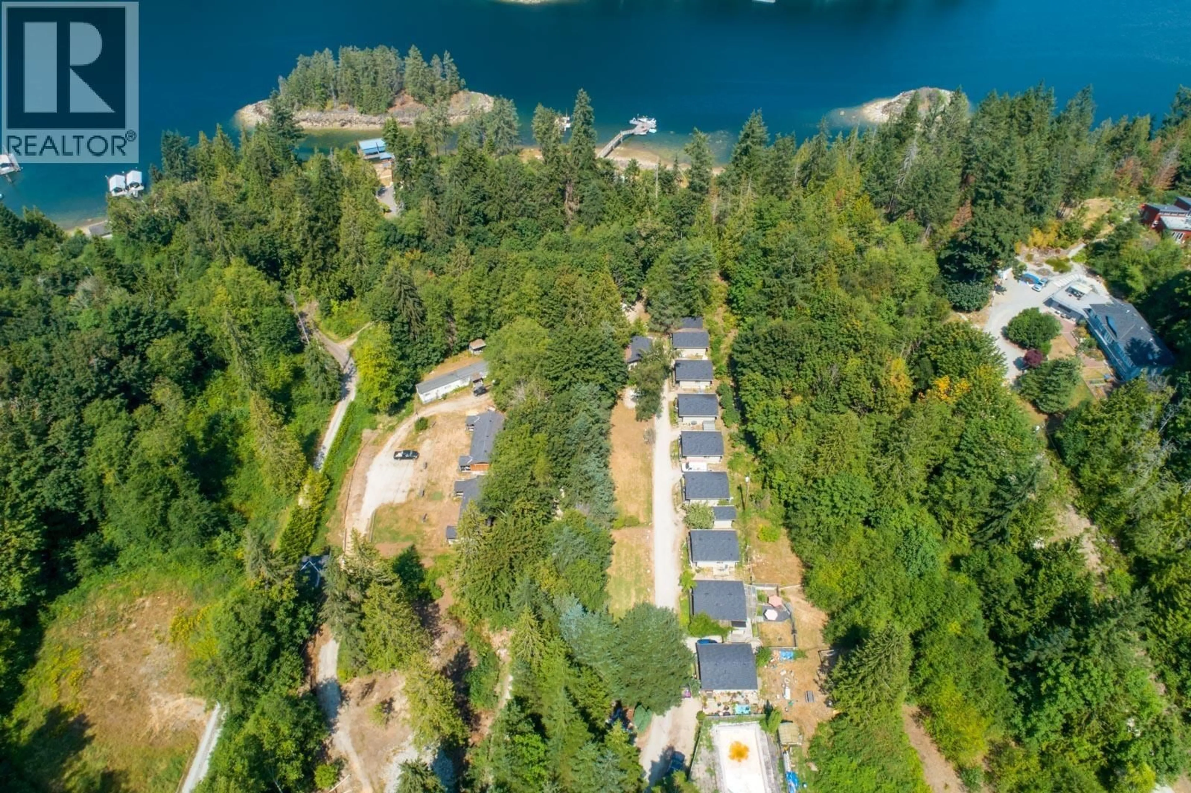 A pic from outside/outdoor area/front of a property/back of a property/a pic from drone, water/lake/river/ocean view for 12881 SUNSHINE COAST HIGHWAY, Madeira Park British Columbia V0N2H1