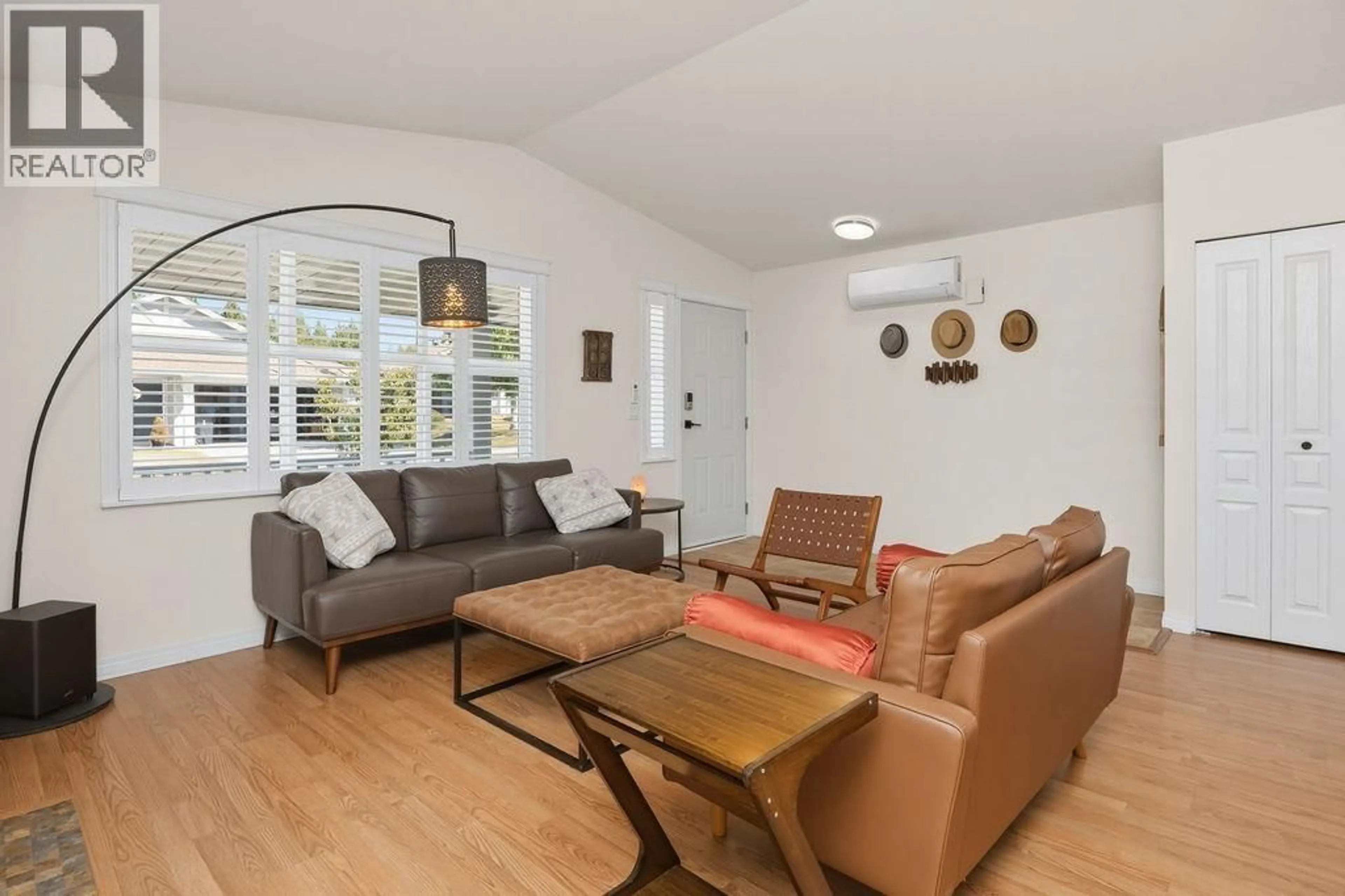 Living room with furniture, wood/laminate floor for 5636 CASCADE CRESCENT, Sechelt British Columbia V7Z0M7