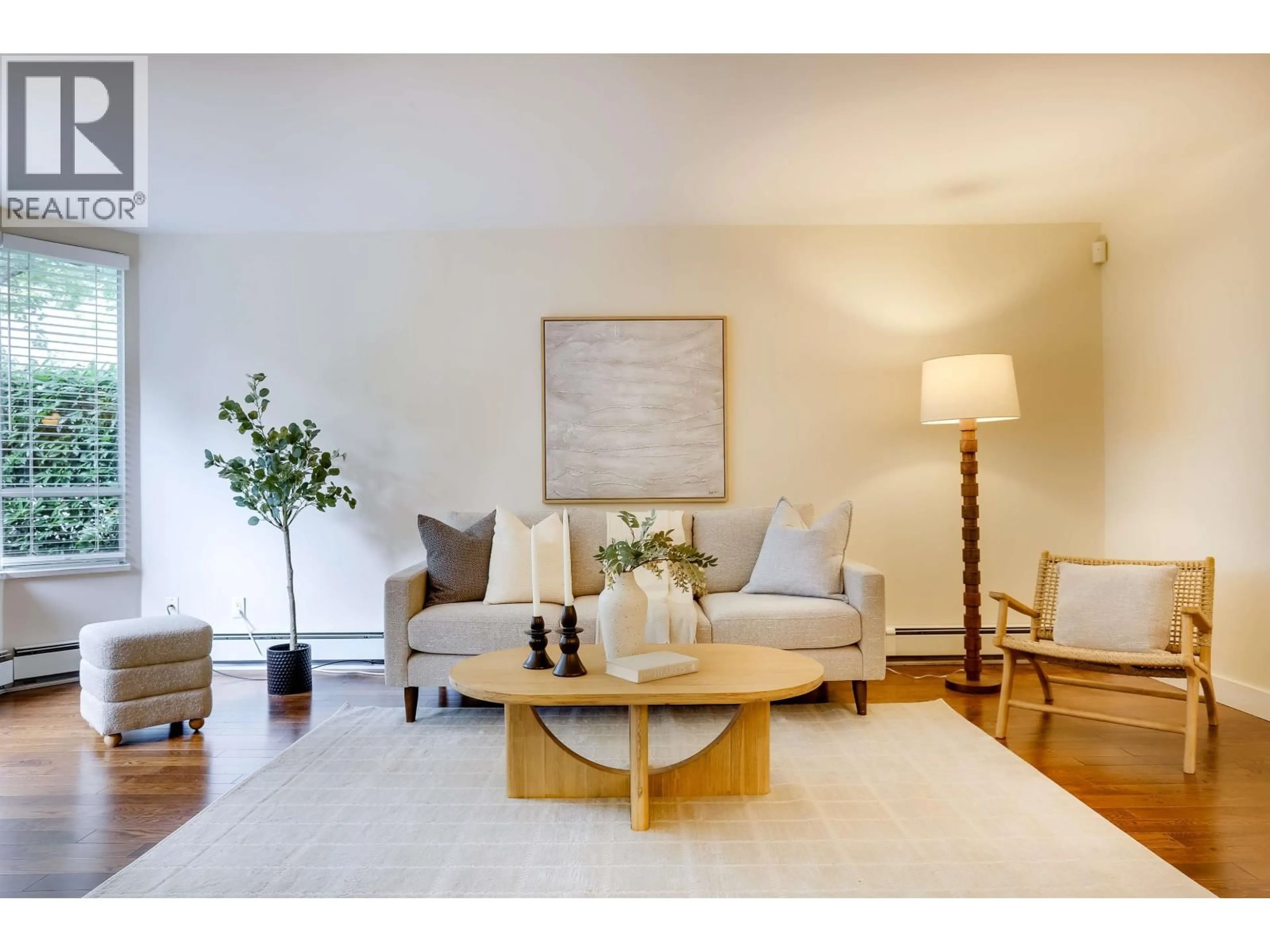 Living room with furniture, wood/laminate floor for 104 - 518 MOBERLY ROAD, Vancouver British Columbia V5Z4G3