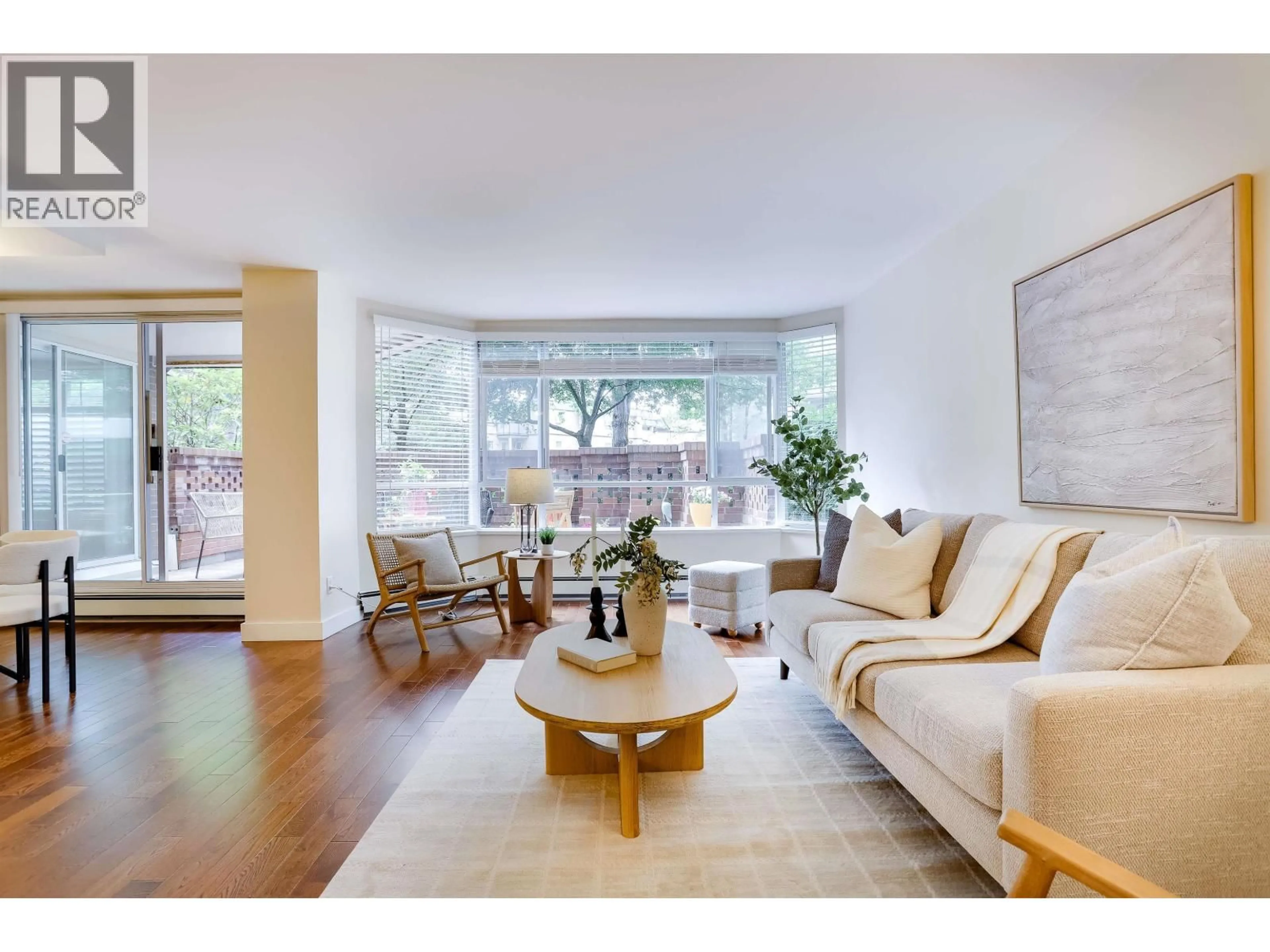 Living room with furniture, wood/laminate floor for 104 - 518 MOBERLY ROAD, Vancouver British Columbia V5Z4G3