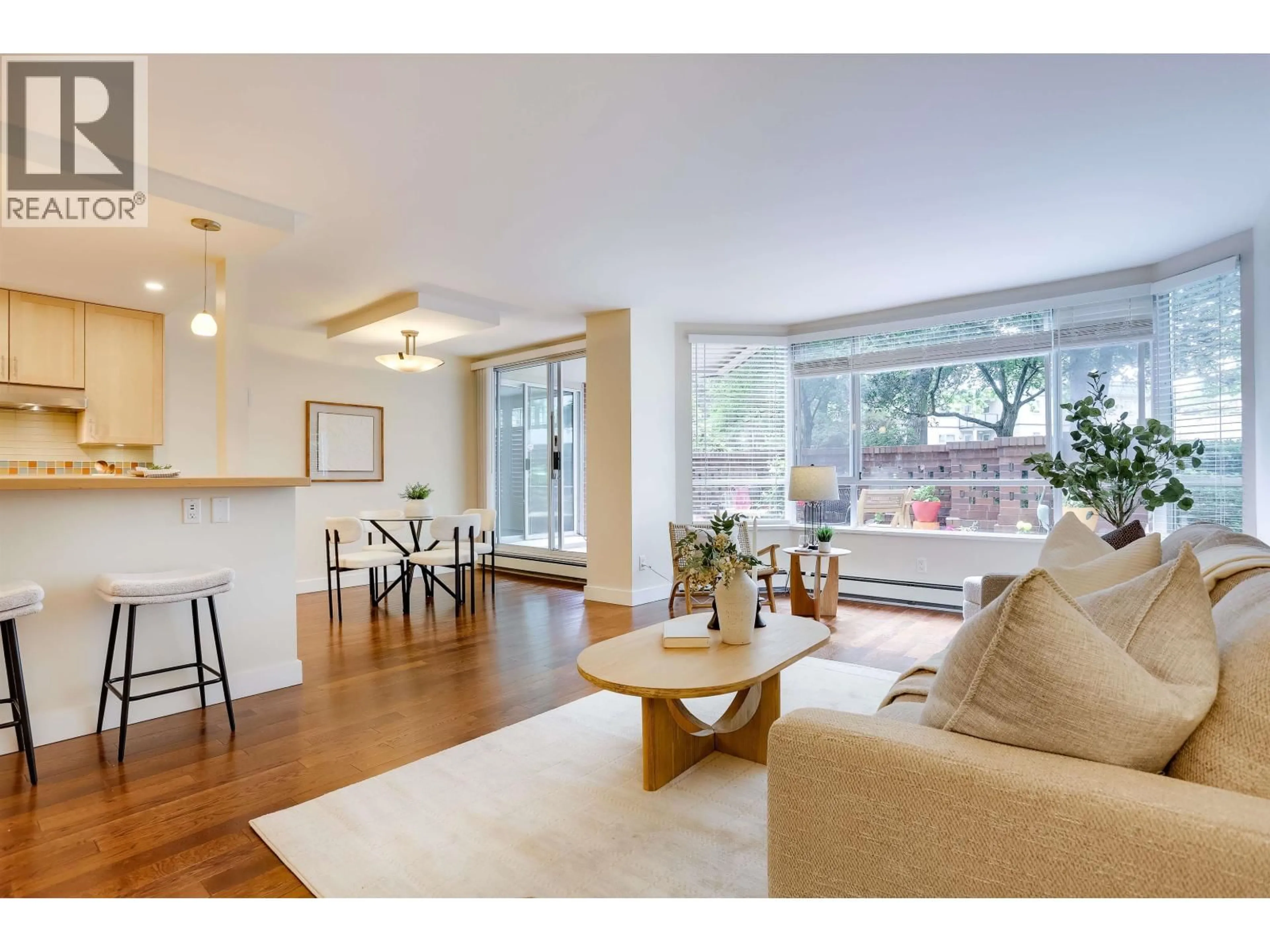 Living room with furniture, wood/laminate floor for 104 - 518 MOBERLY ROAD, Vancouver British Columbia V5Z4G3