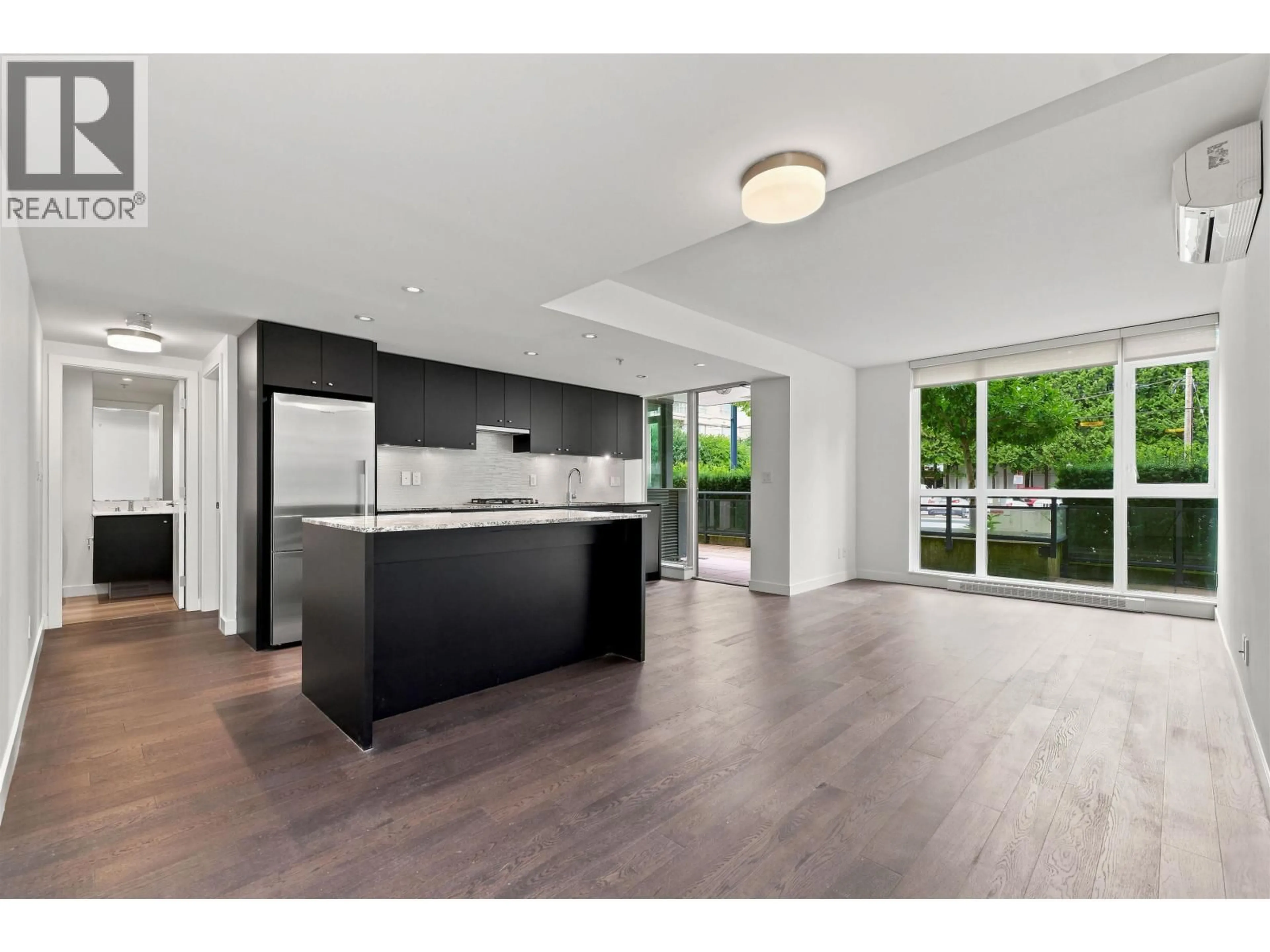 Open concept kitchen, wood/laminate floor for 108 - 6180 COONEY ROAD, Richmond British Columbia V6Y0H2