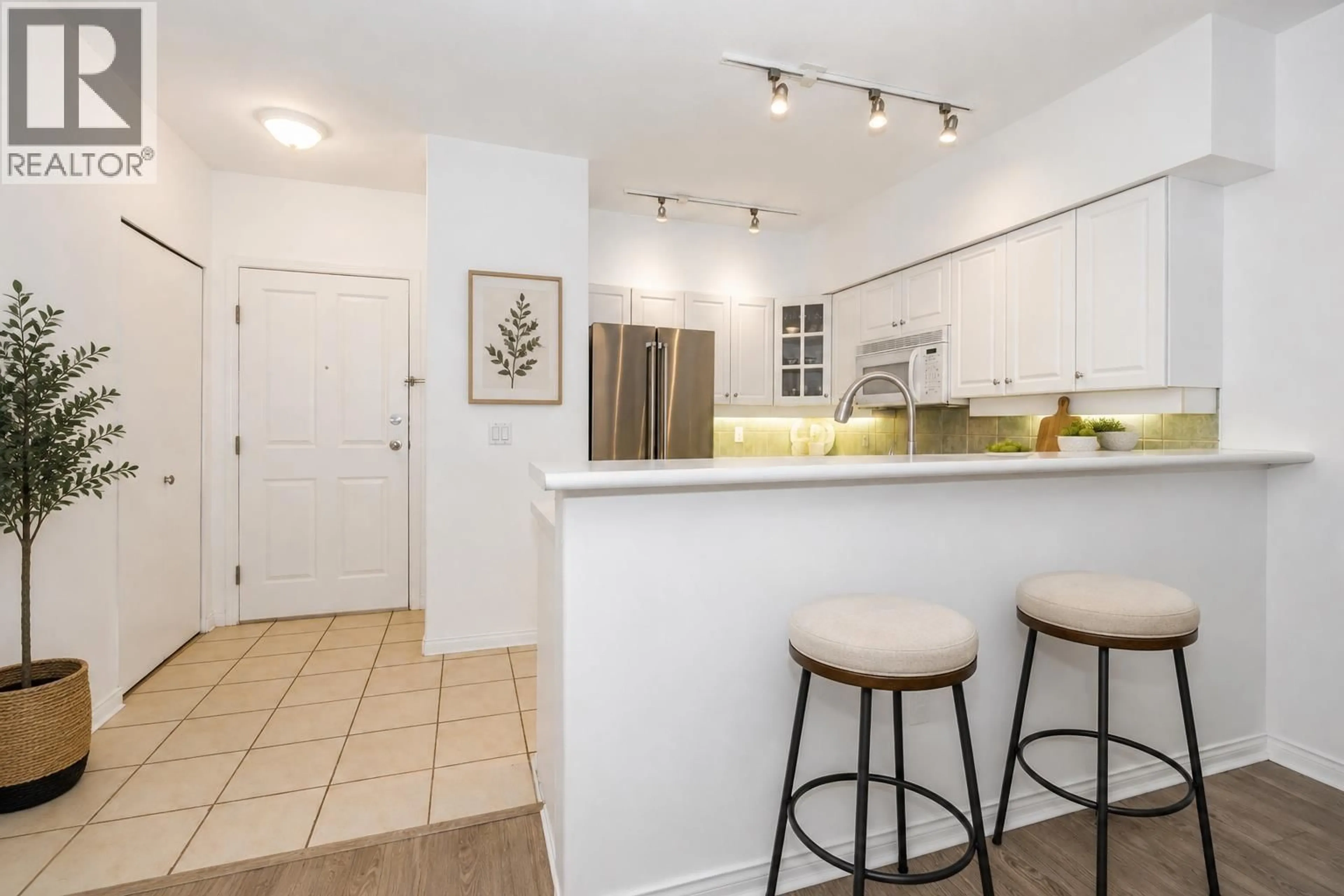 Open concept kitchen, ceramic/tile floor for 104 - 2755 MAPLE STREET, Vancouver British Columbia V6J5K1