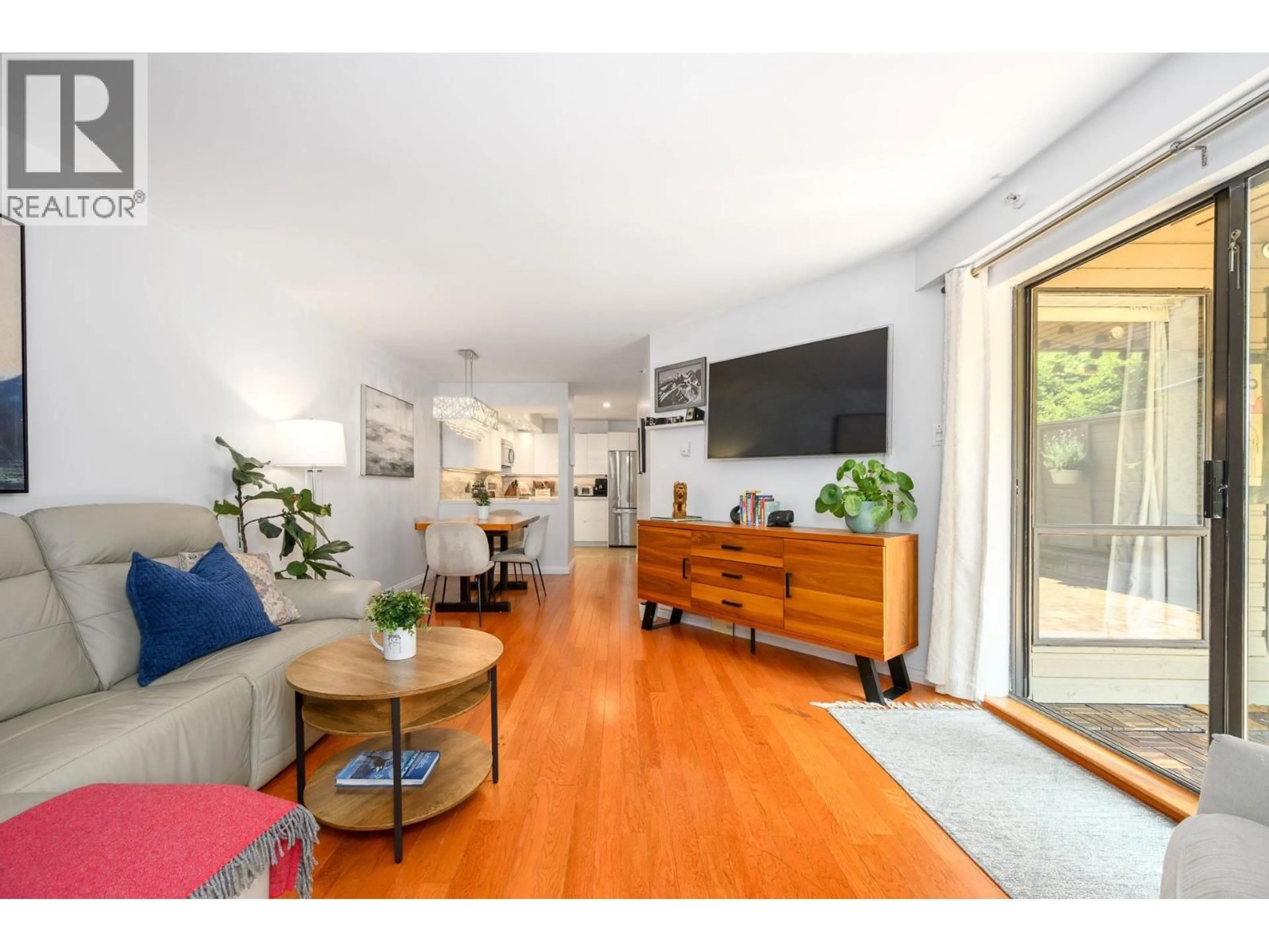 Living room with furniture, wood/laminate floor for 104 - 1500 PENDRELL STREET, Vancouver British Columbia V6G3A5