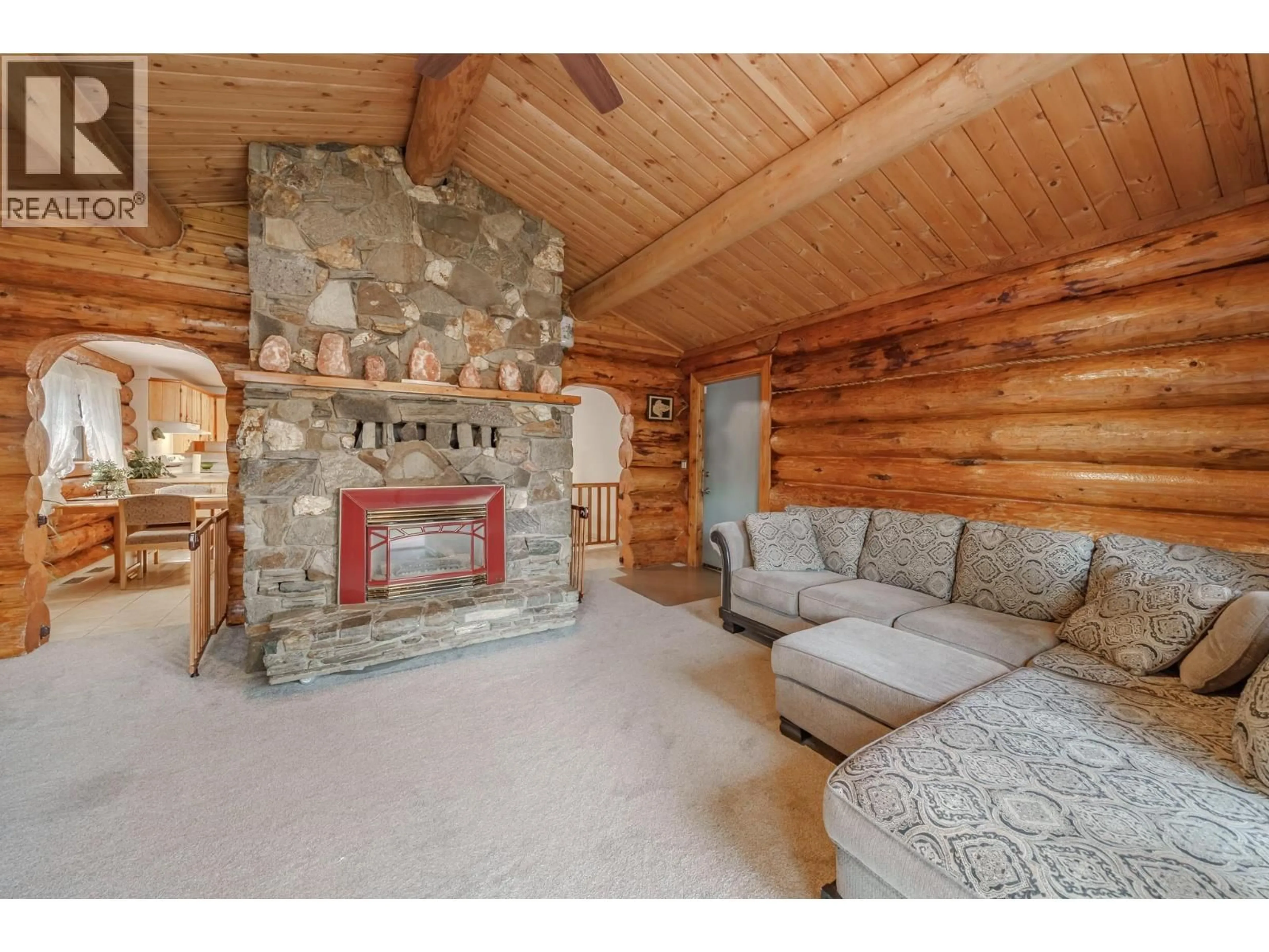 Living room with furniture, wood/laminate floor for 5406 PARK DRIVE, 103 Mile House British Columbia V0K2E1