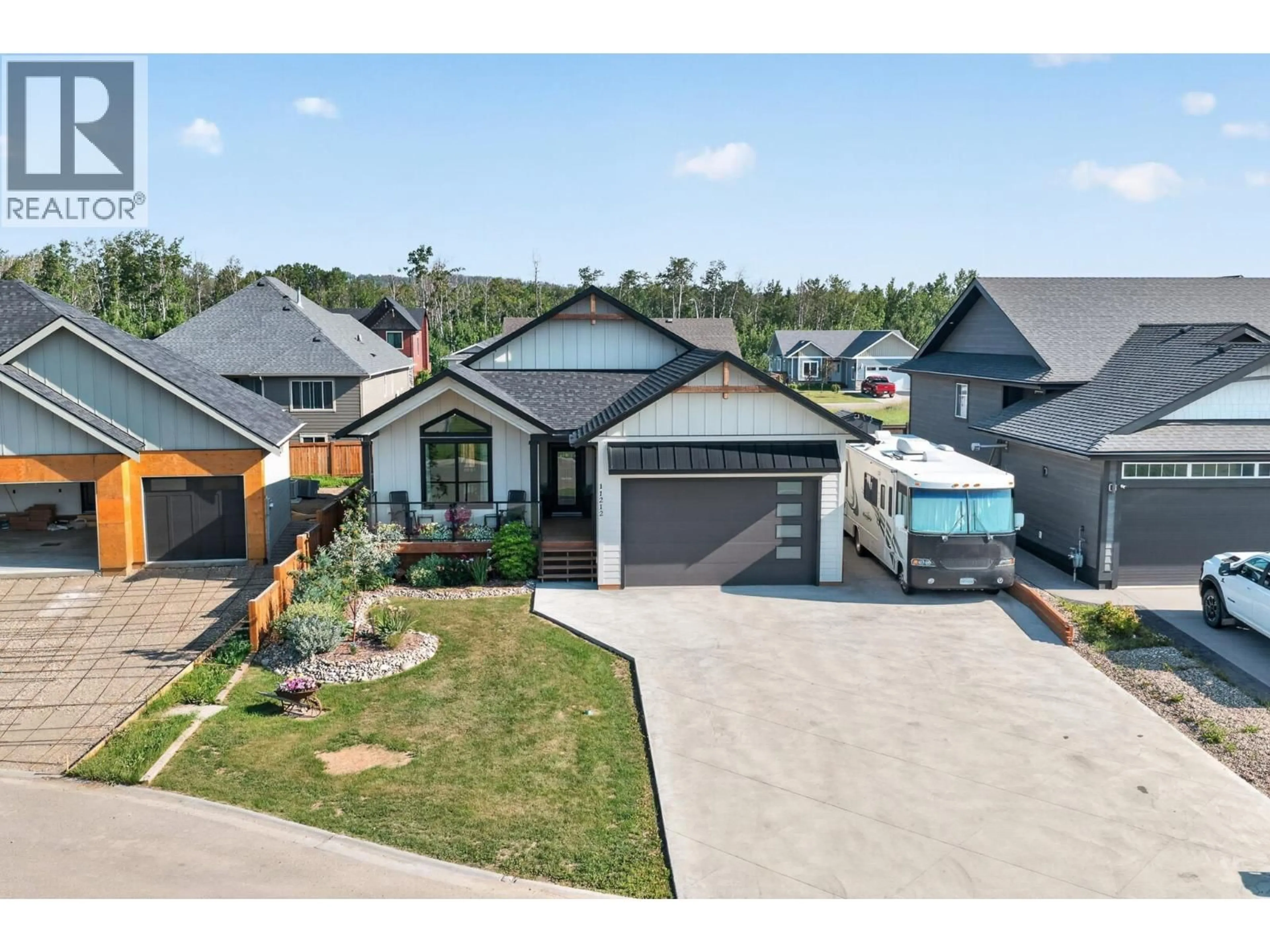 A pic from outside/outdoor area/front of a property/back of a property/a pic from drone, street for 11212 114 AVENUE, Fort St. John British Columbia V1J0R5