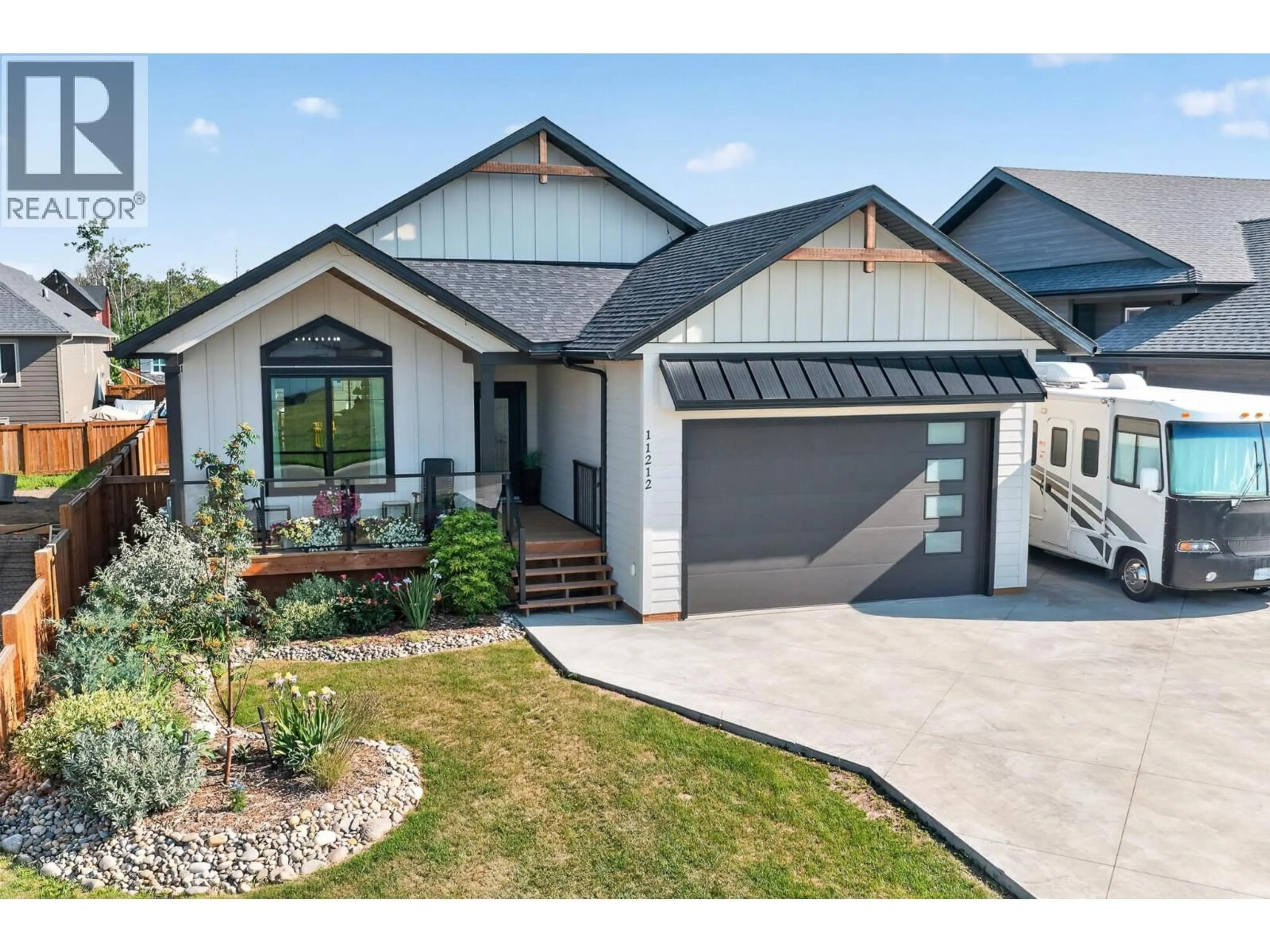 Home with vinyl exterior material, street for 11212 114 AVENUE, Fort St. John British Columbia V1J0R5