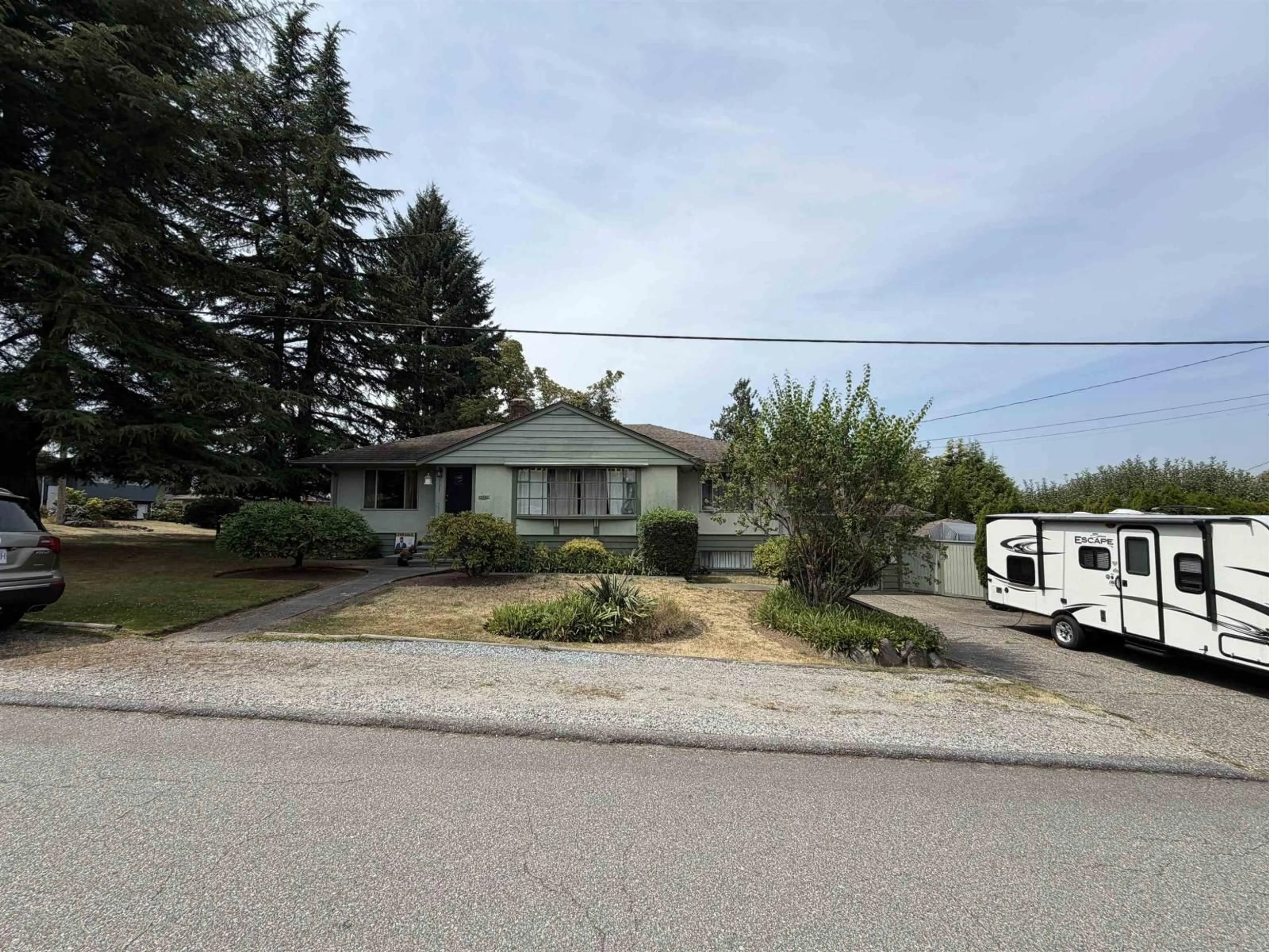 A pic from outside/outdoor area/front of a property/back of a property/a pic from drone, street for 11321 136A STREET, Surrey British Columbia V3R3C4