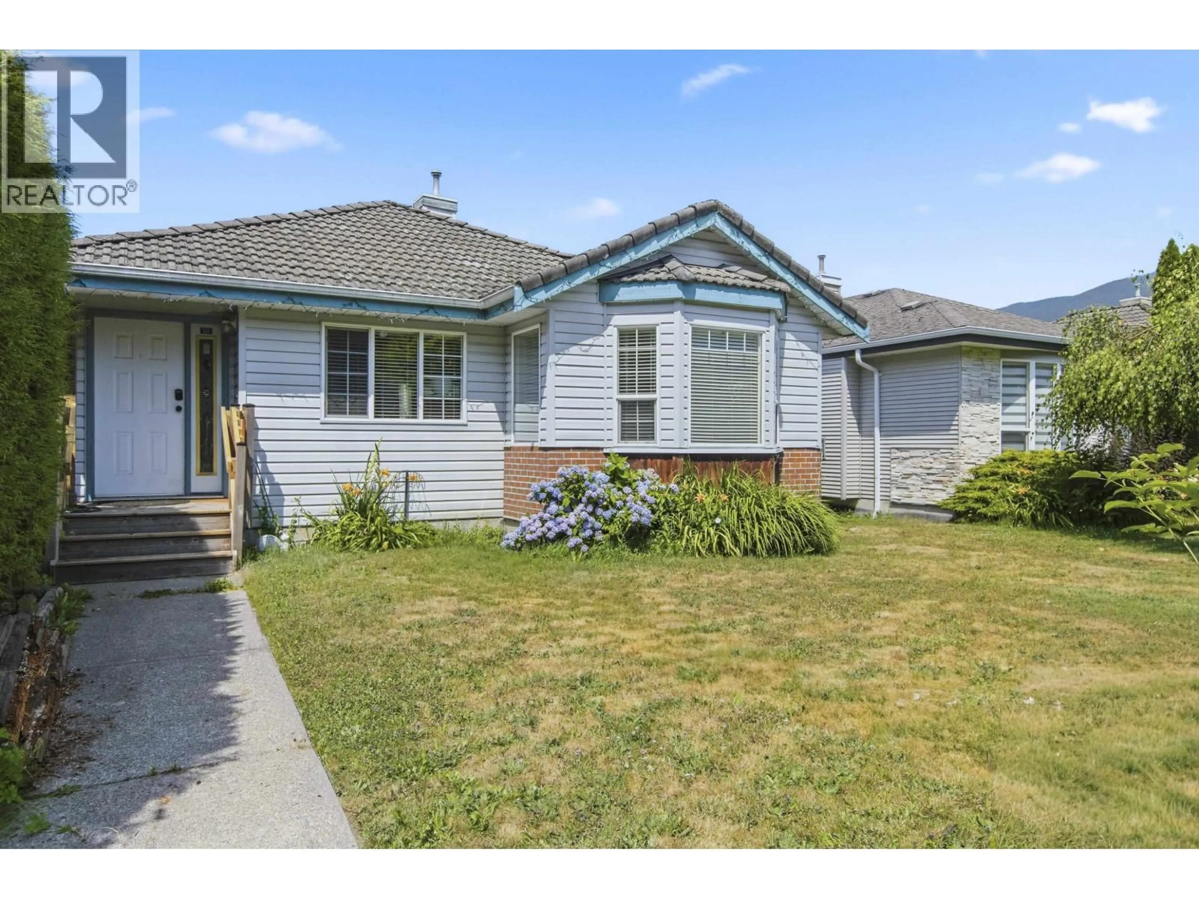 Home with vinyl exterior material, street for 1827 MAMQUAM ROAD, Squamish British Columbia V0N1T0