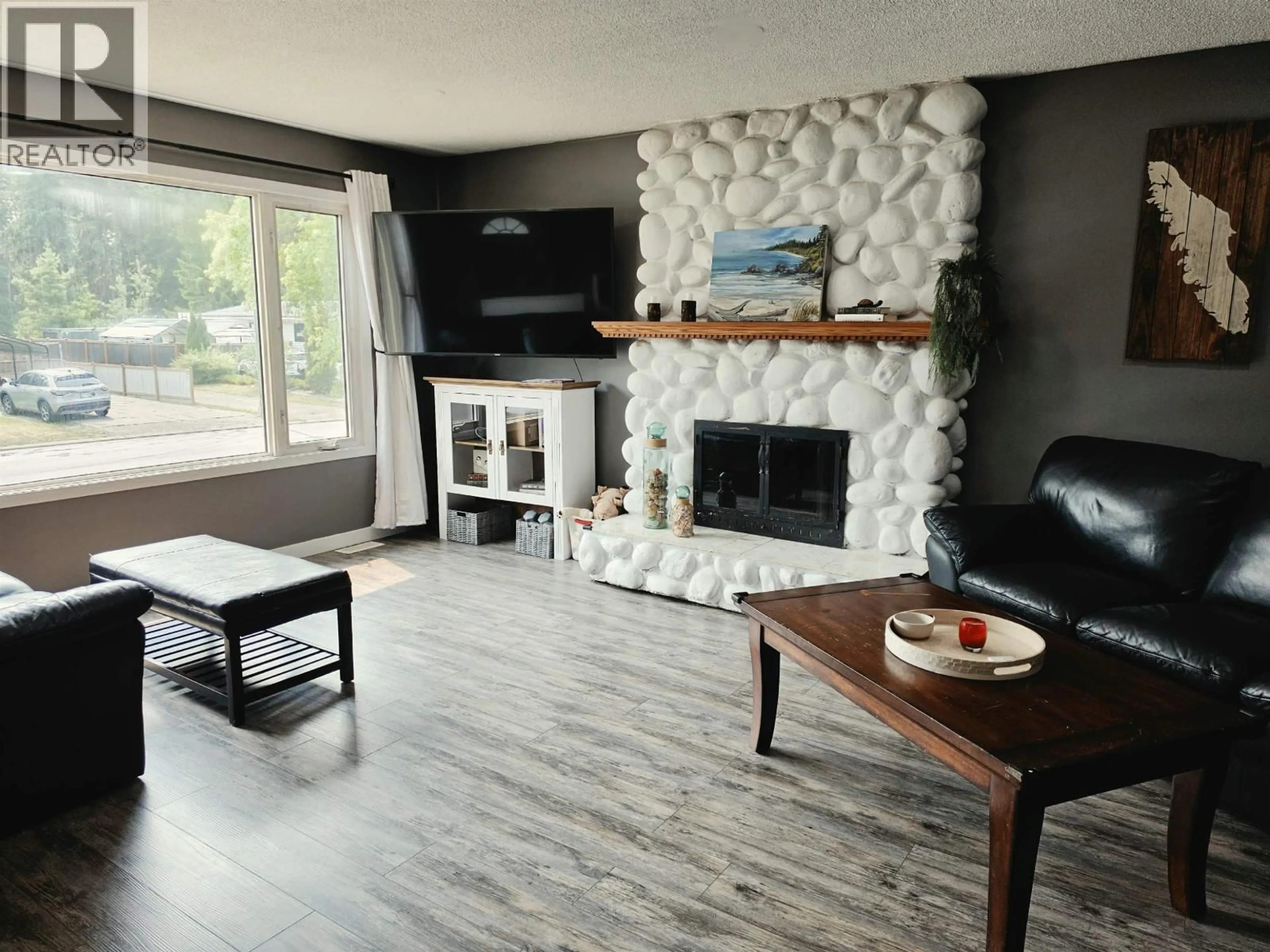 Living room with furniture, wood/laminate floor for 2484 LISGAR CRESCENT, Prince George British Columbia V2N1C5