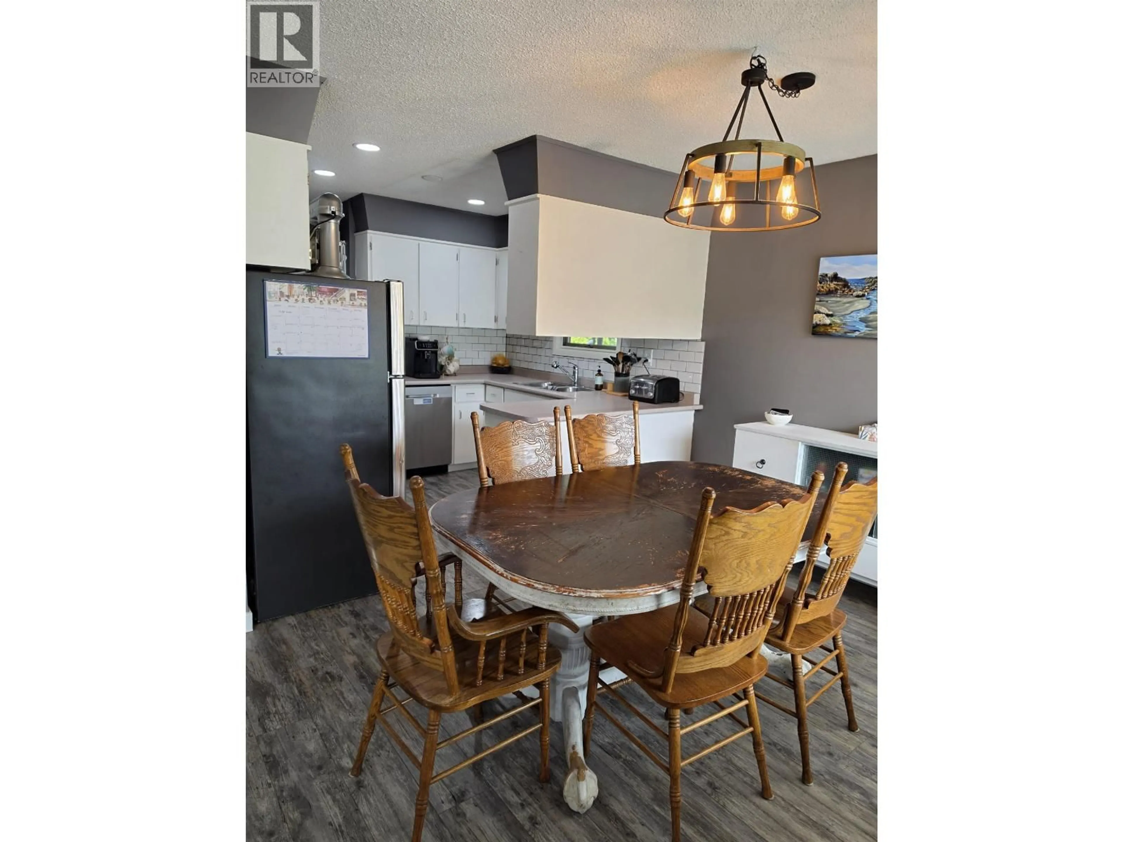 Open concept kitchen, wood/laminate floor for 2484 LISGAR CRESCENT, Prince George British Columbia V2N1C5