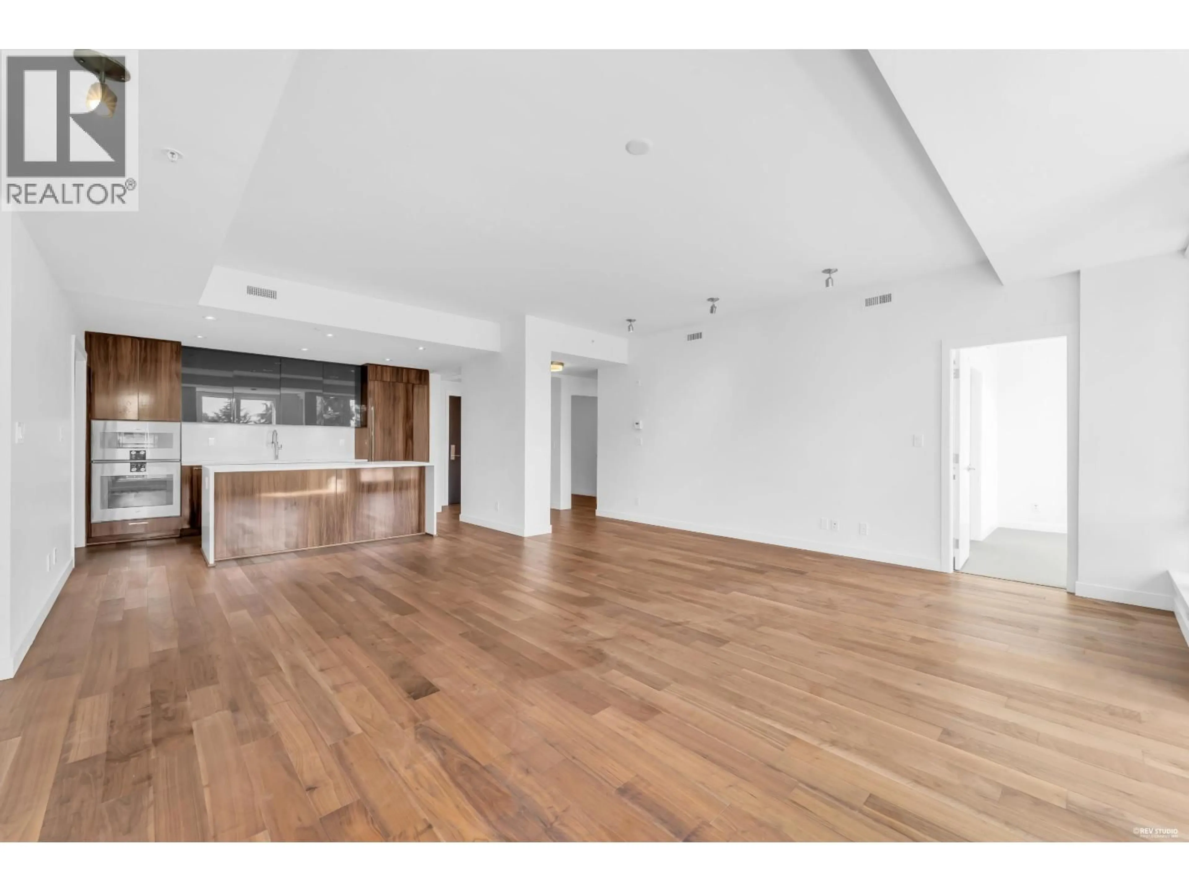 Open concept kitchen, wood/laminate floor for 406 - 4408 CAMBIE STREET, Vancouver British Columbia V5Y0M2