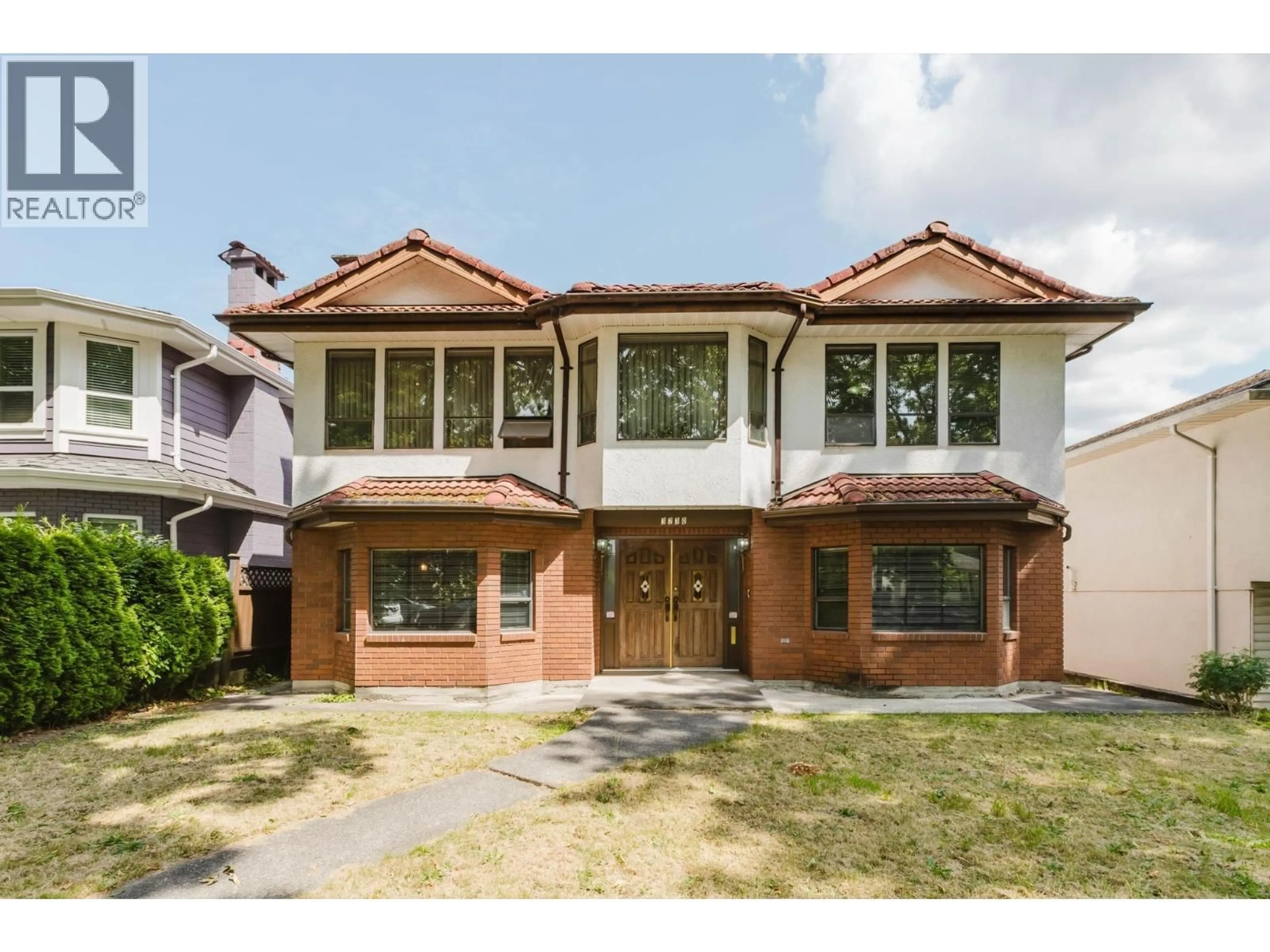 Home with brick exterior material, street for 3230 GARDEN DRIVE, Vancouver British Columbia V5N4Y1