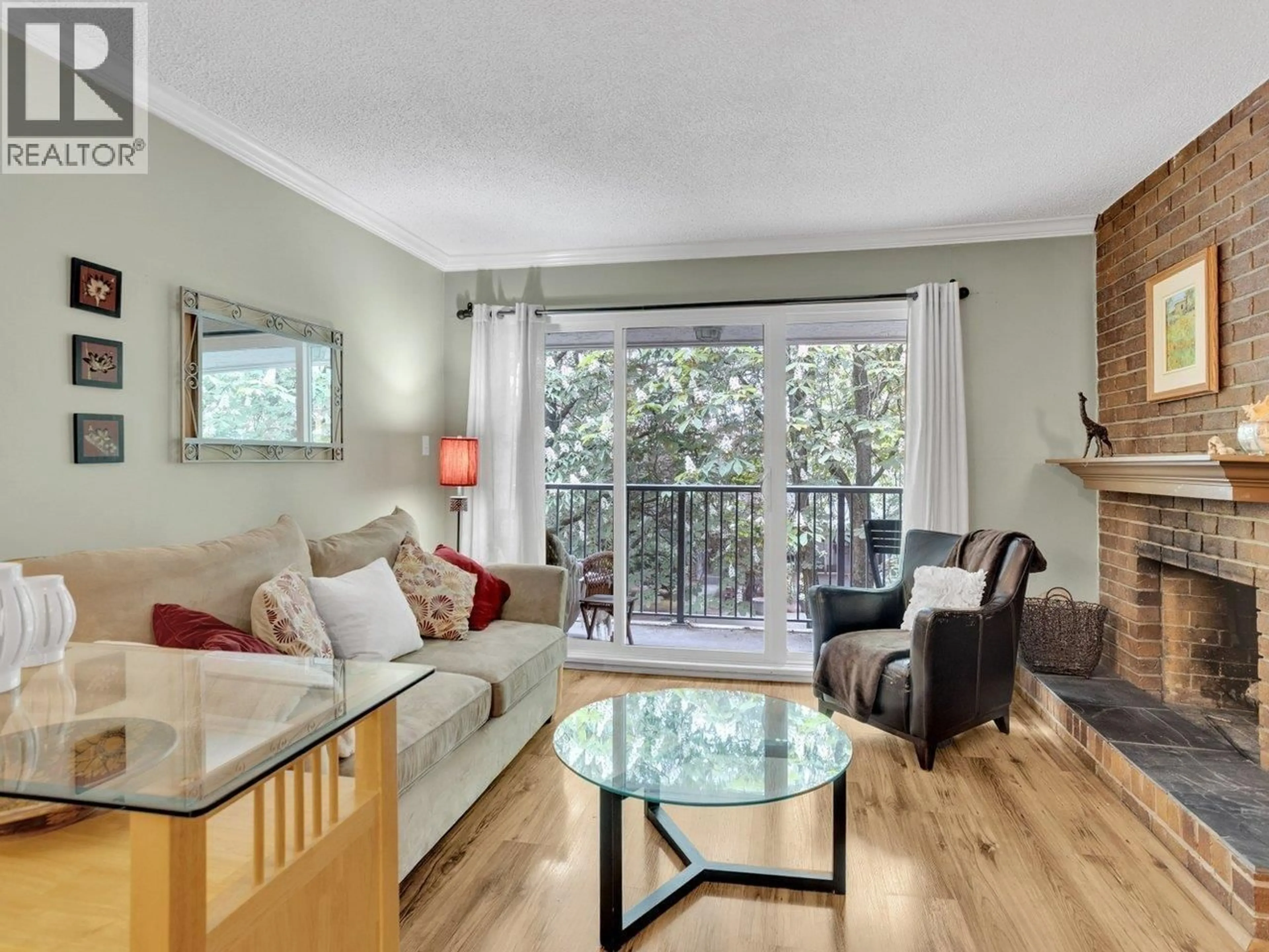 Living room with furniture, wood/laminate floor for 303 - 1234 PENDRELL STREET, Vancouver British Columbia V6E1L6