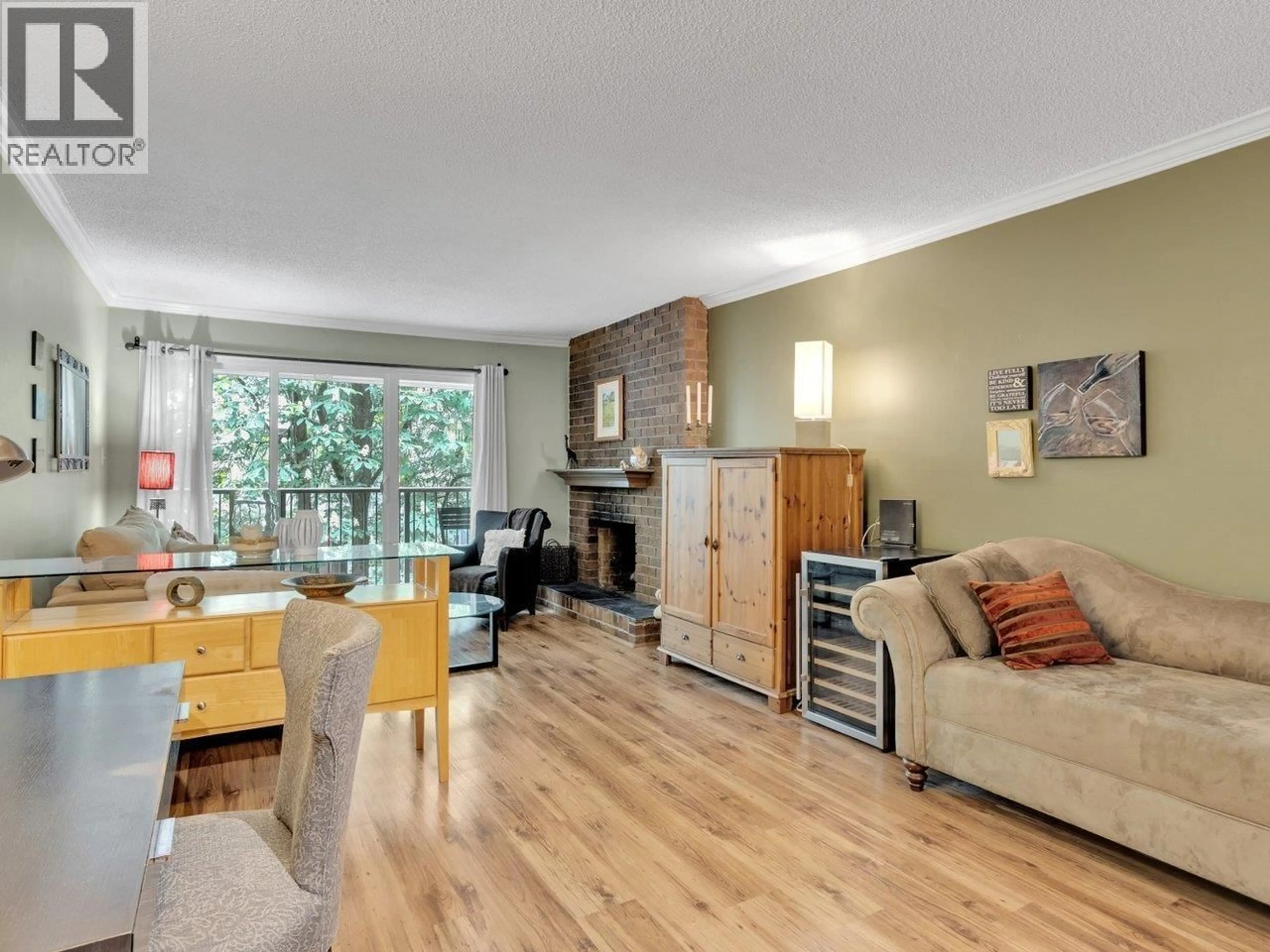 Living room with furniture, wood/laminate floor for 303 - 1234 PENDRELL STREET, Vancouver British Columbia V6E1L6